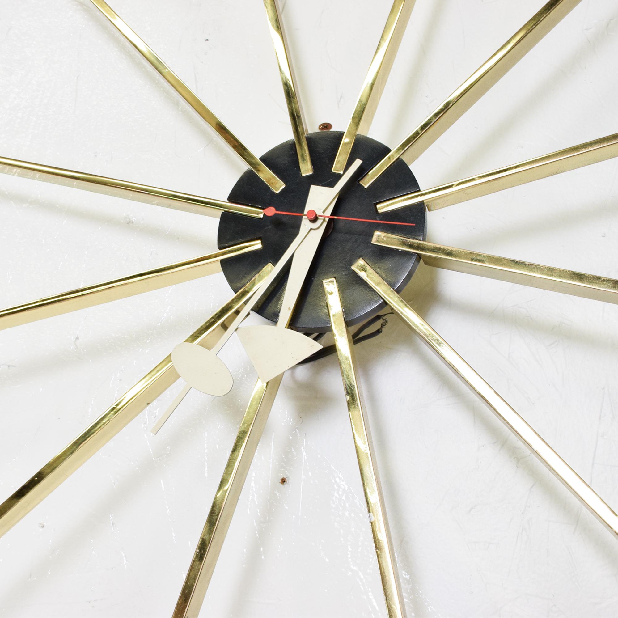 Vintage Mid-Century Modern brass wall clock by George Nelson for Howard Miller.
Brass spike starburst sunburst design modern exaggerated original arms
The USA, circa 1960s.
Dimensions: 24 in diameter x 2 inches depth.
Vintage condition