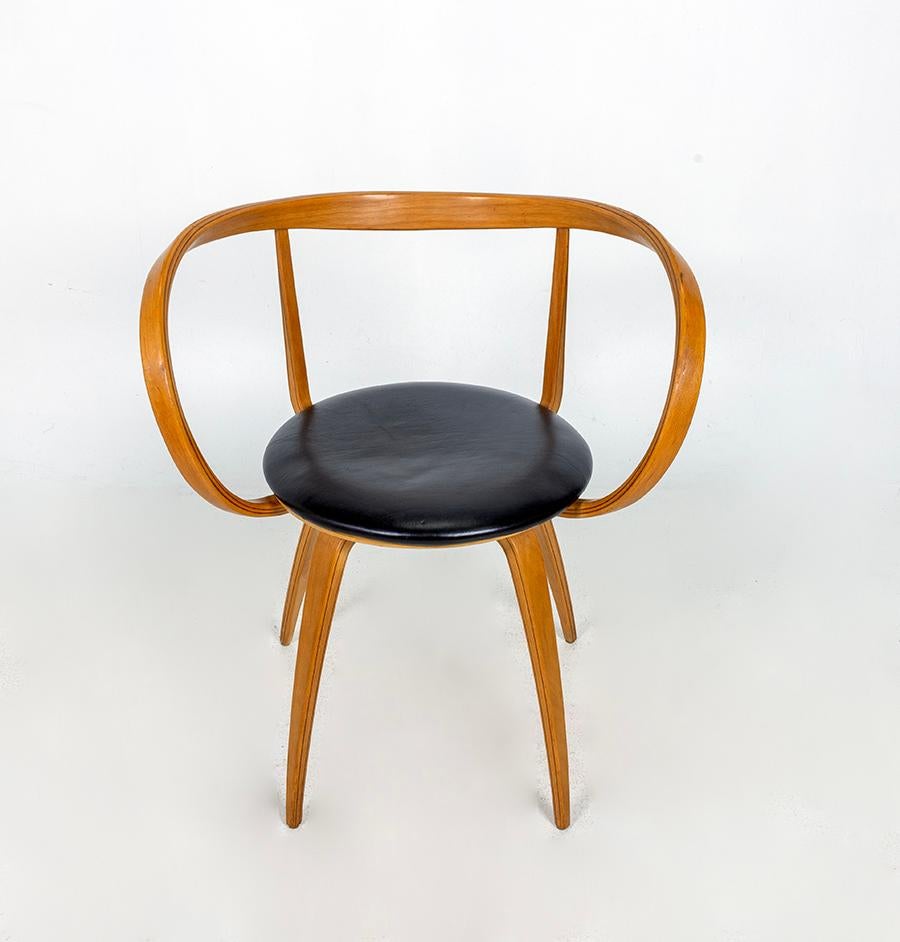 Rare and beautiful ''Pretzel'' ArmChair, laminated wood and dark brown leather seat.  Manufactured in the 1984/1986 in Italy by ICF De Padova. Price is for one chair. Pair available. 