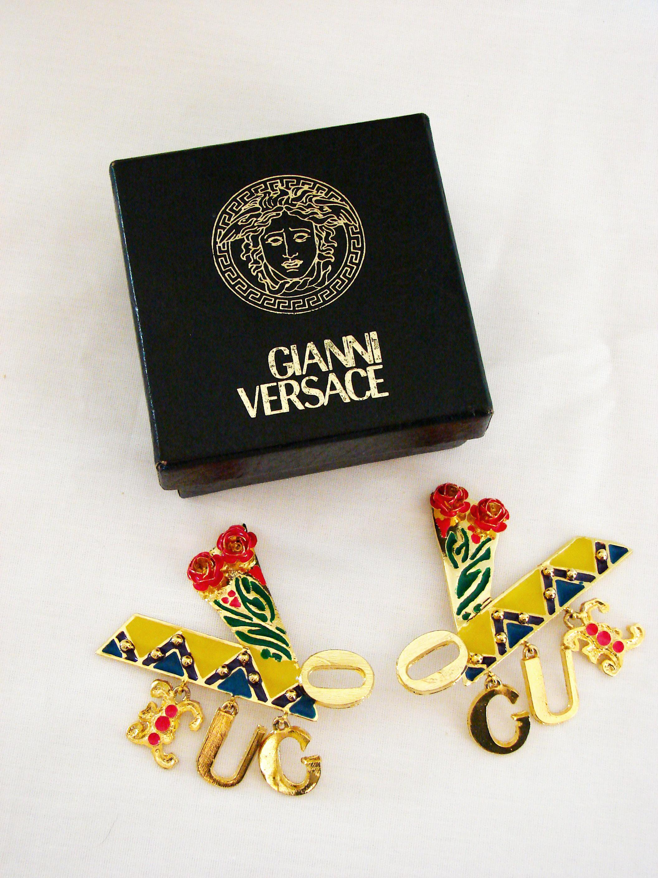 Massive gold earrings from Gianni Versace c1990 feature colorful enamel and rose details, and spell out the word 'Vogue' with dangling charm letters (very similar to the reboot version Donatella released at Milan Fashion week, sported by Kaia