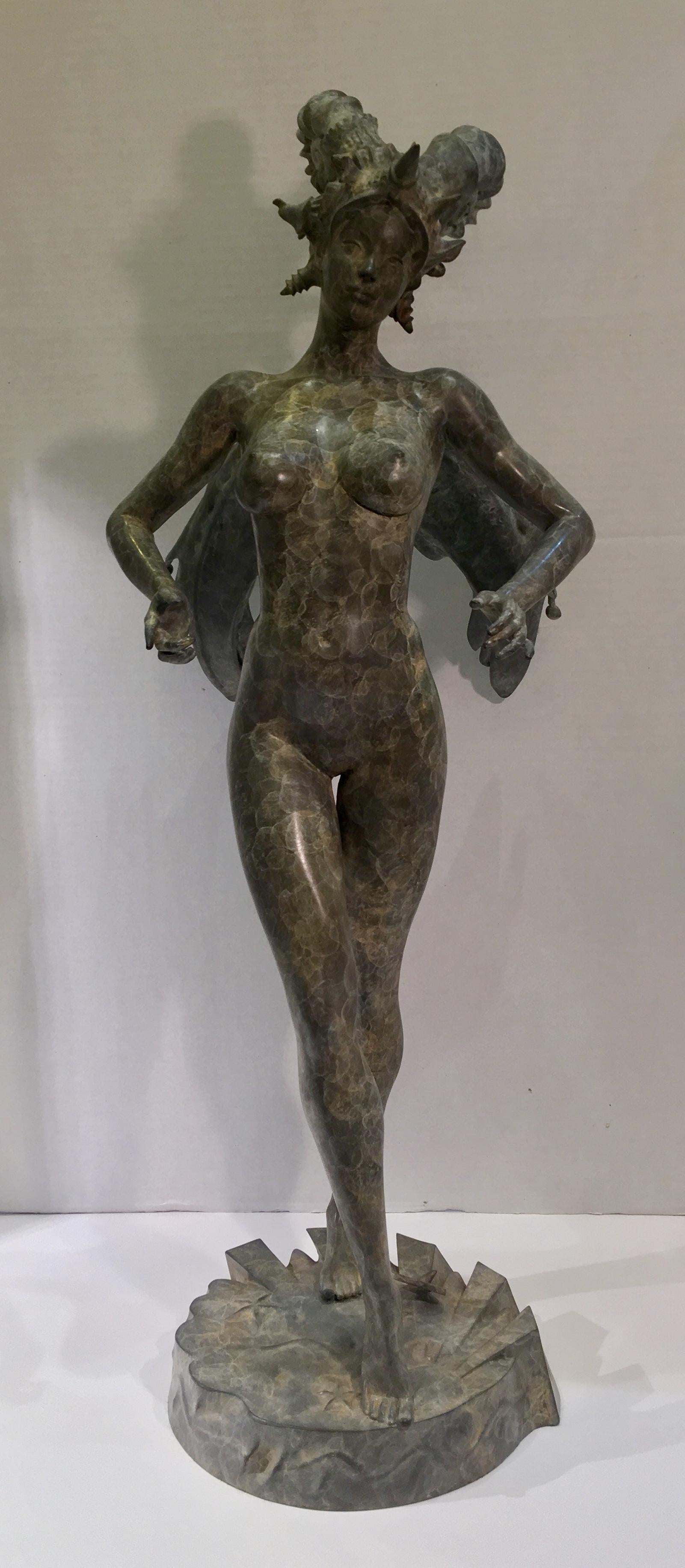 Dramatic, cast bronze sculpture of a standing, winged, statuesque nude woman with ram horns. Bronze has a very artistic marbleized patina.


