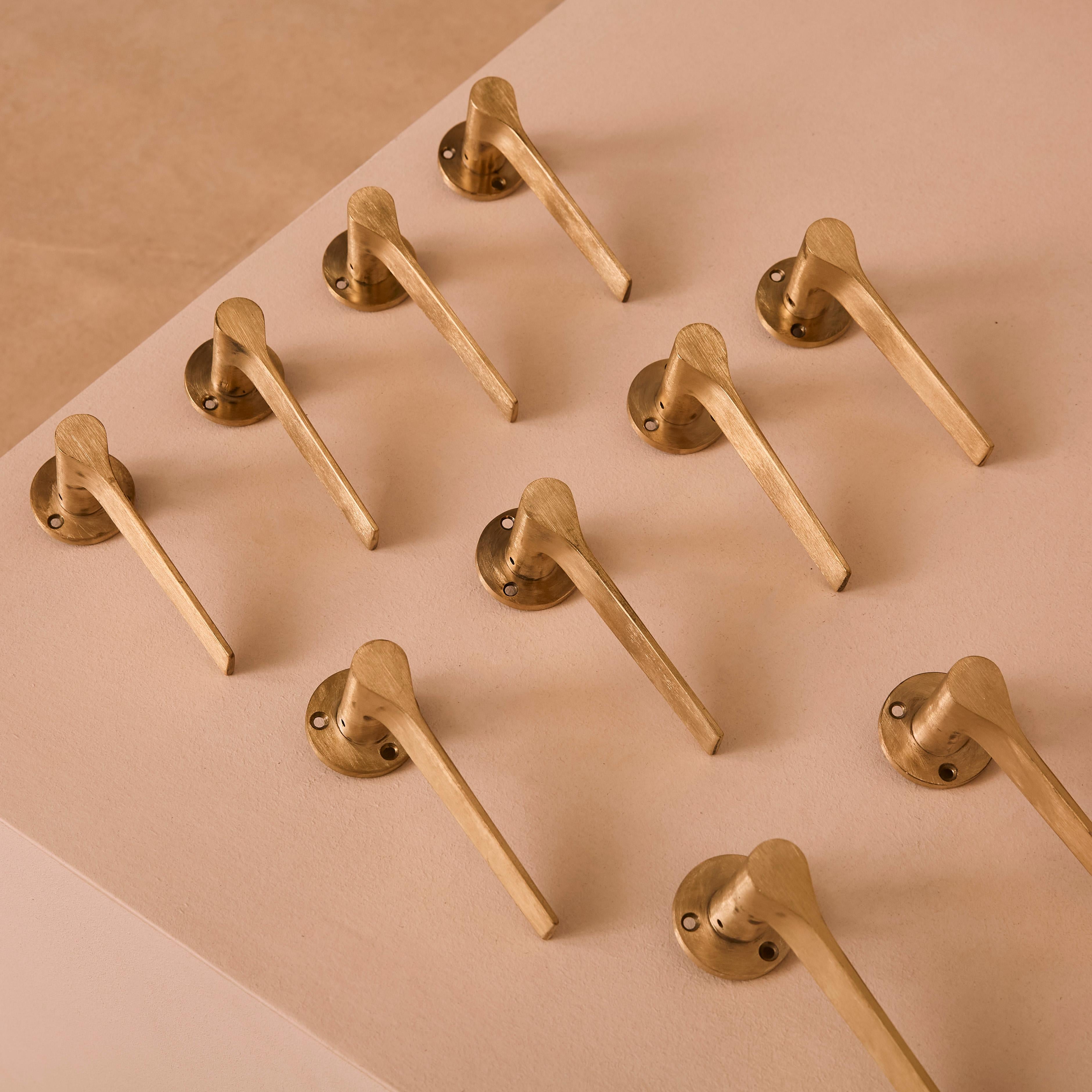 Brass Lama lever handles with escutcheons by Gio Ponti for Olivari.
 