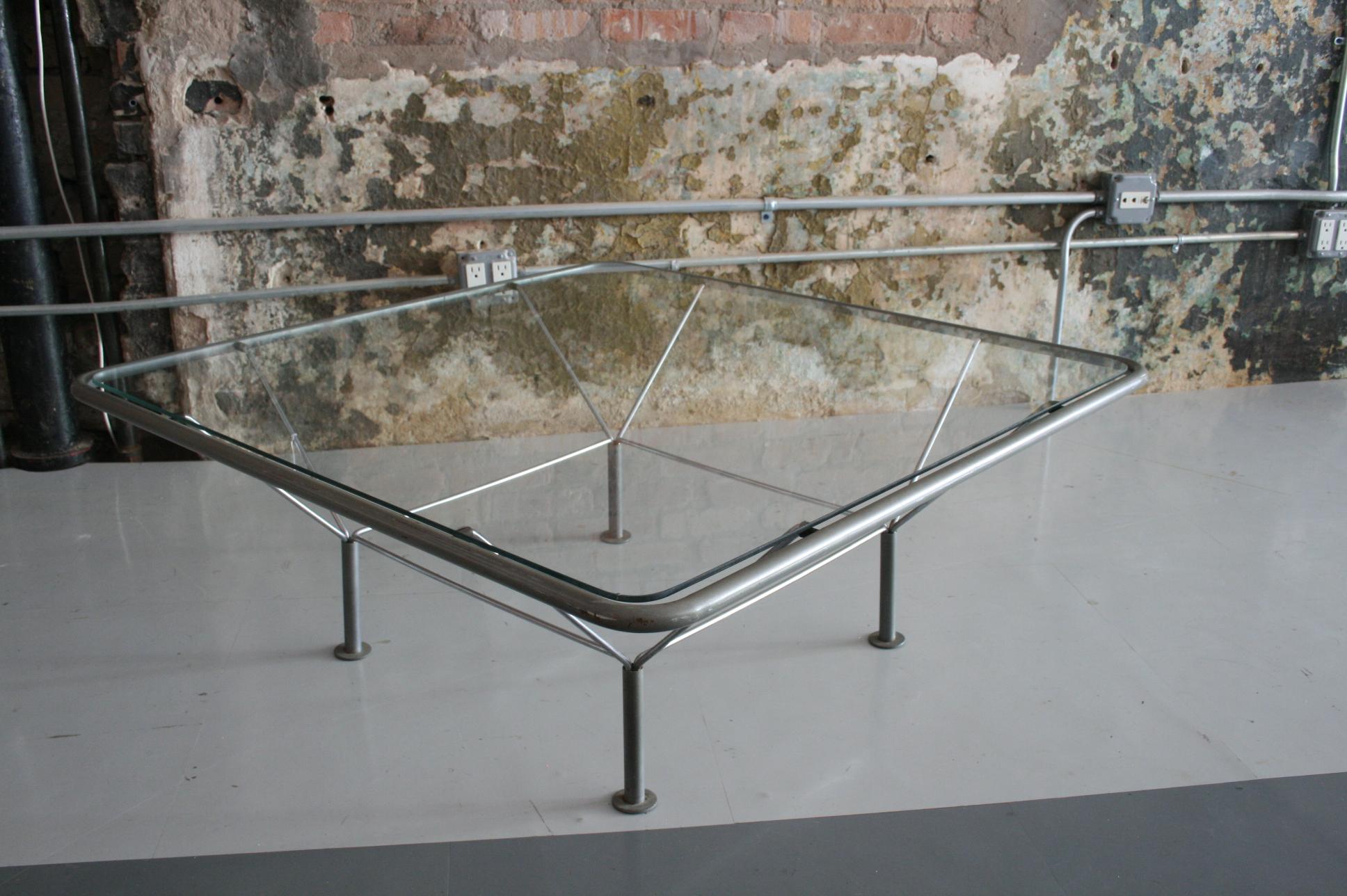 Coffee table

Designed by Niels Bendtsen

Denmark, circa 1980s

Glass and refinished metal

Measure: 15” H x 39.5” W x 39.5” D.