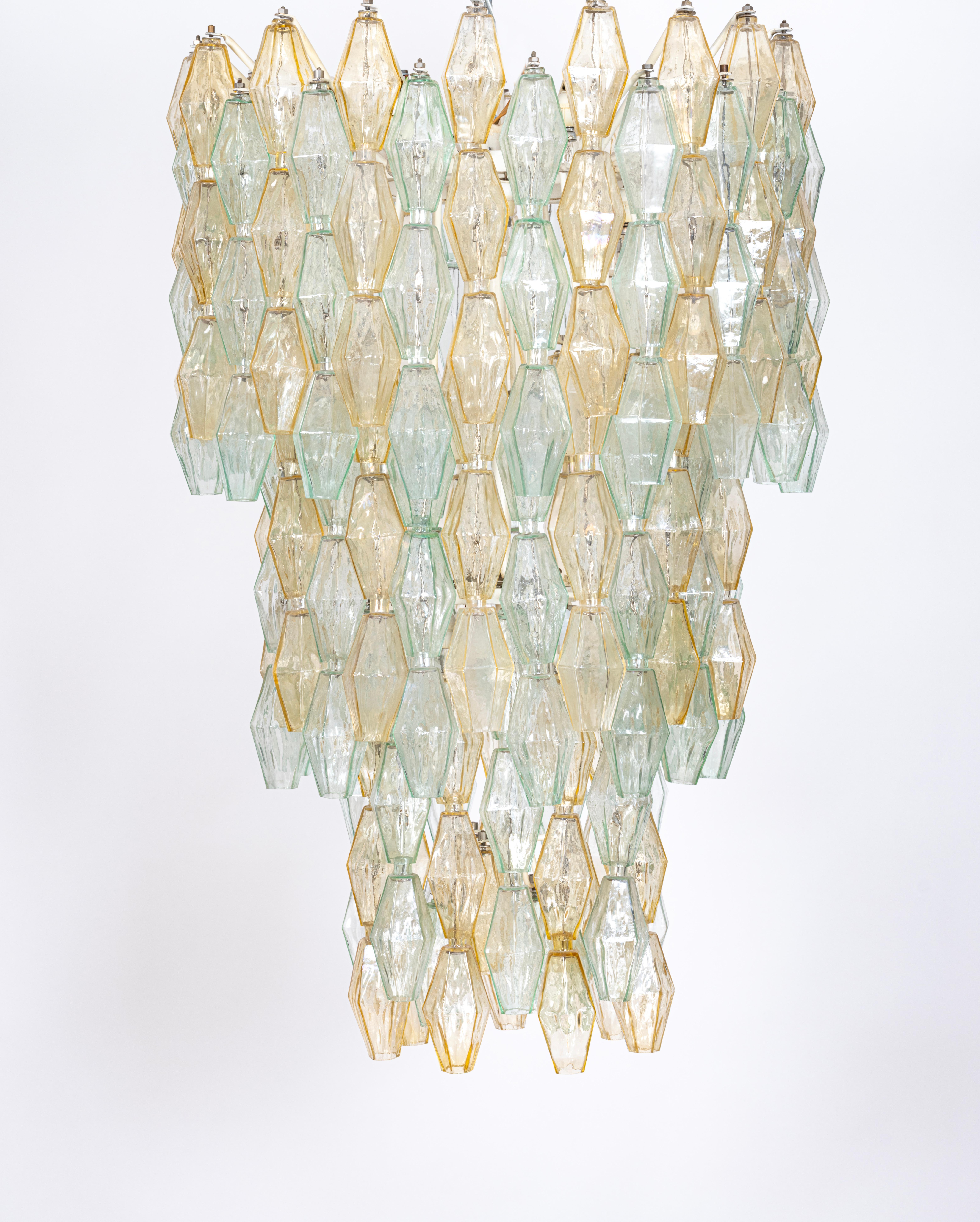 A rare and original green and yellow glass poliedri (polyhedron) chandelier designed by the Italian architect and designer, Carlo Scarpa, c.1960. Produced by the prestigious Murano glass company, Venini, the x 228 hand-made glass poliedri pieces
