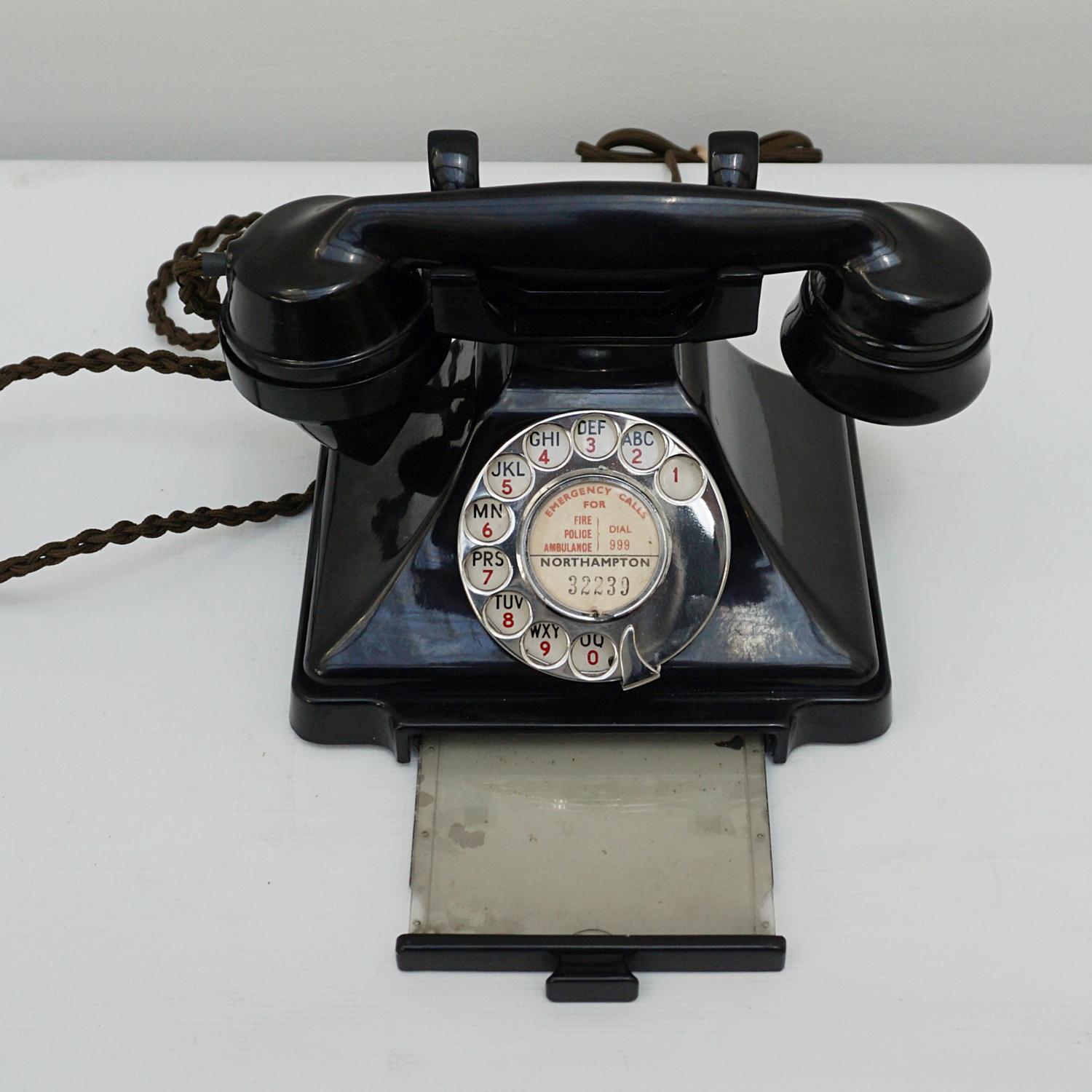 An original GPO model 232L Telephone. Black bakelite with integral drawer and braided handset cord. Registered number to face.

Dimensions: H 15cm W 20cm D 16cm

Origin: English

Date: 1938

Item No: N1703225

All of our telephones are