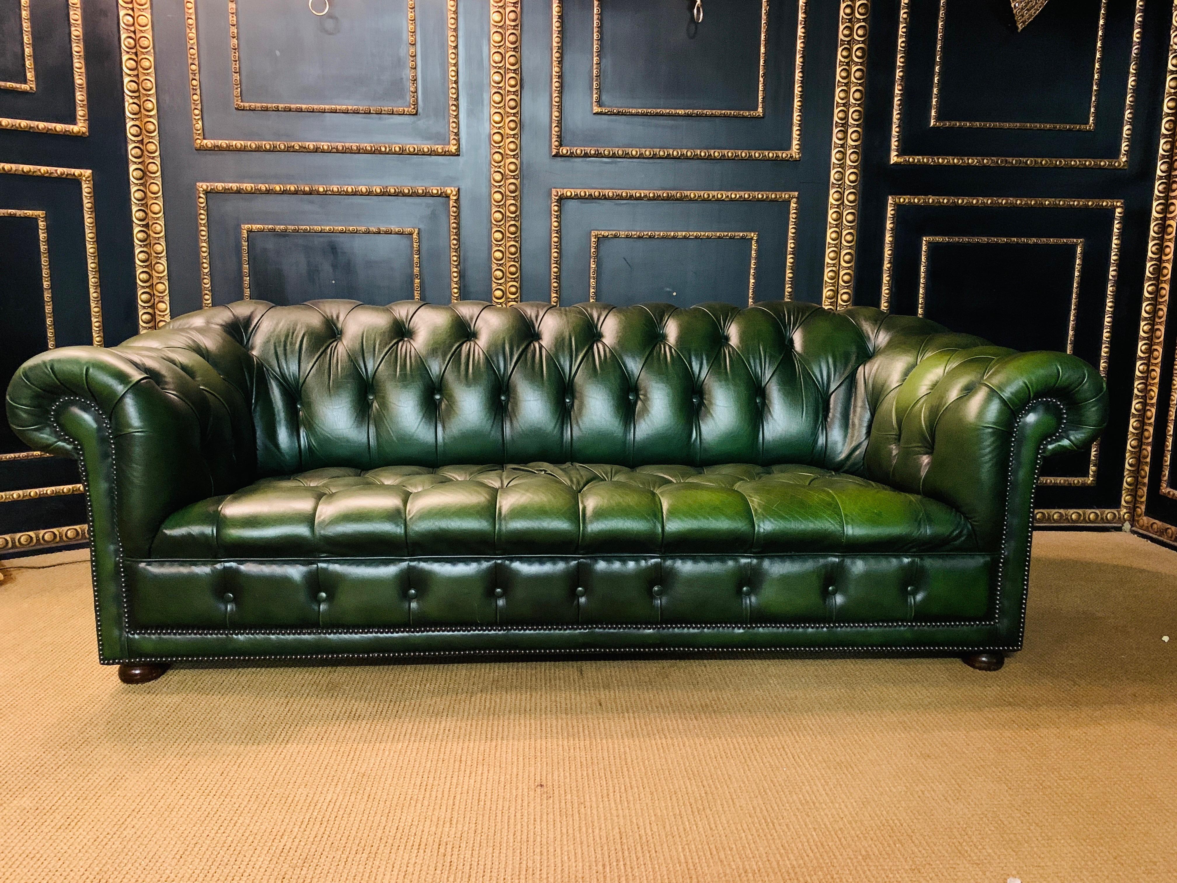 Original Chesterfield sofa, quilted seat and back strong leather. Color is green, seats are with Classic laced feather floor. Fantastic
Vintage, no cracks unique patina.
Do not miss this unique opportunity.
The missing stud can be replaced by