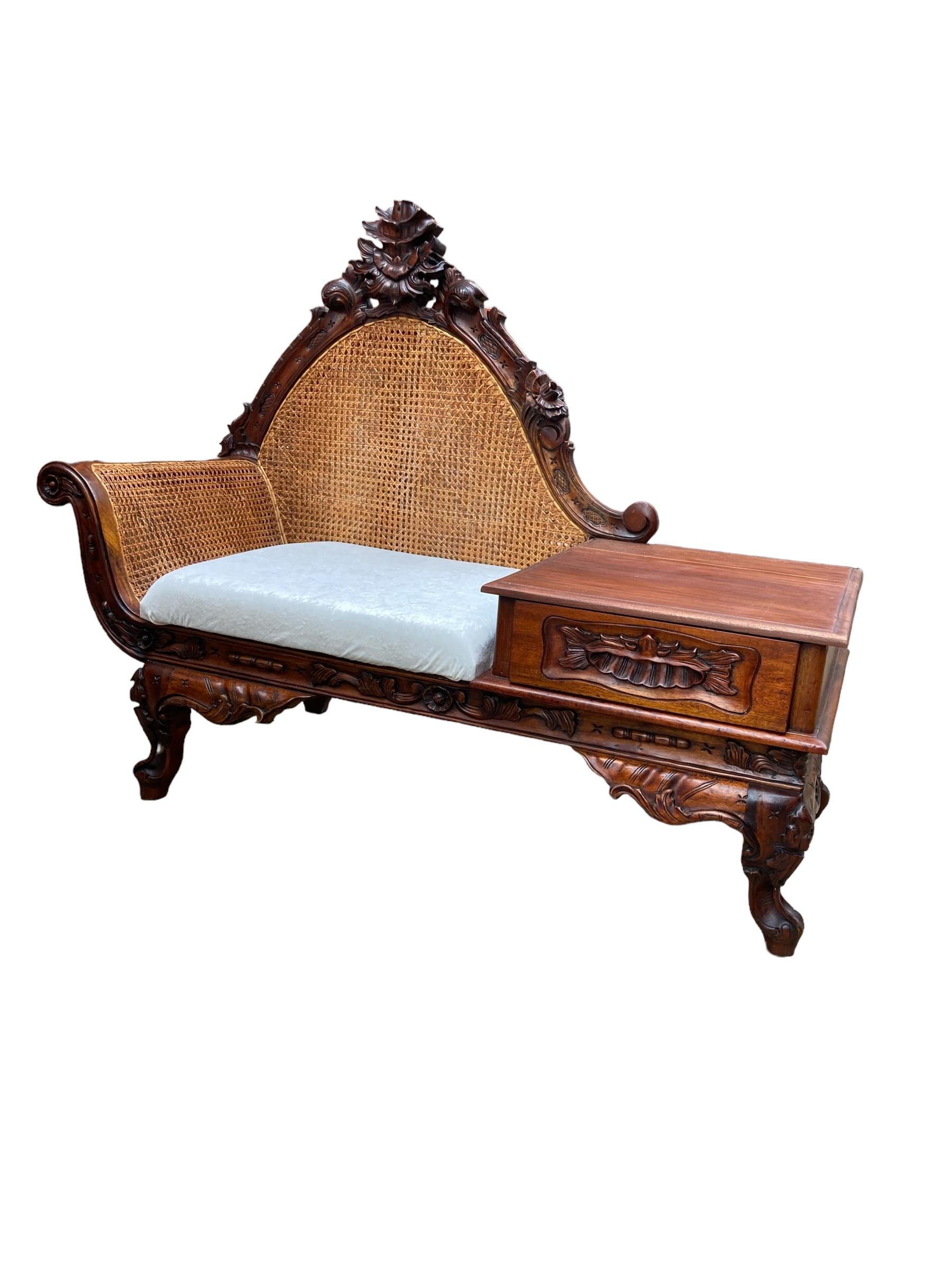 Original Hand Carved Mahogany Victorian Telephone or Gossip Bench, Bergere Backing and armrest rest. Single Drawer set on carved ornate legs. Cream Paris Boucle upholstered cushion.
H: 110cm
L: 140cm
D: 60cm
Seat Height: 42cm