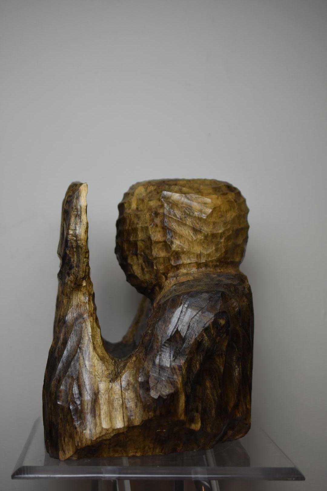 Original hand carved sculpture of person holding their hands in front of their face. Carved from solid ailanthus and allowed to naturally spalt for black coloring. Done in a minimal and primitive style, carved by hand with gouges. Coated in a very