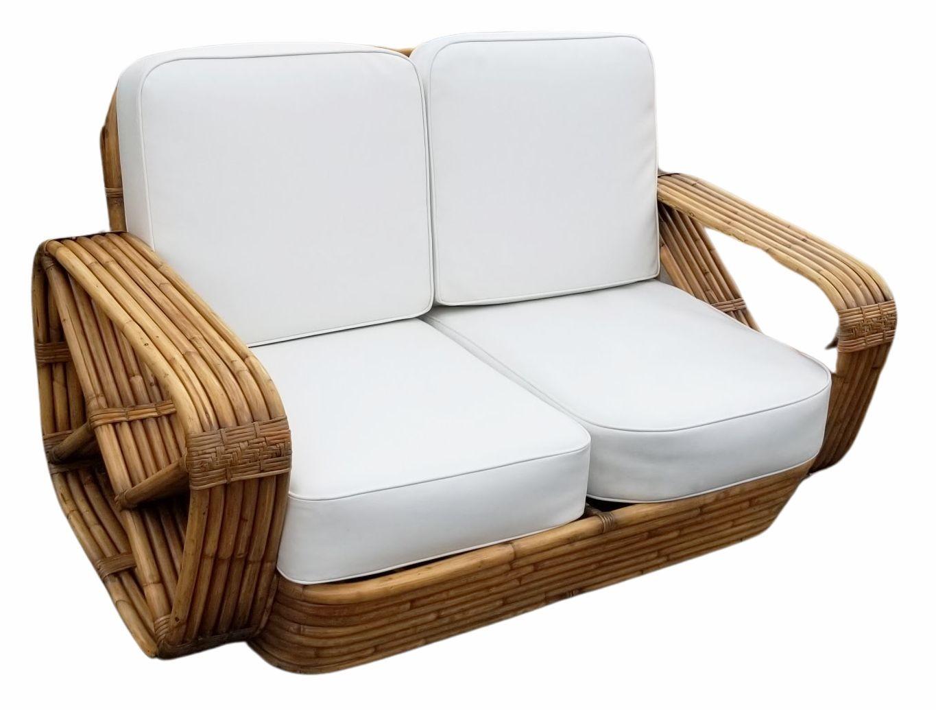 This is a rare museum quality restored rattan Paul Frankl living room set featuring a six-strand square pretzel settee and a matching lounge chair. Featuring Paul Frankl's signature arm wrappings.

This comes directly from a Paul Frankl decorated