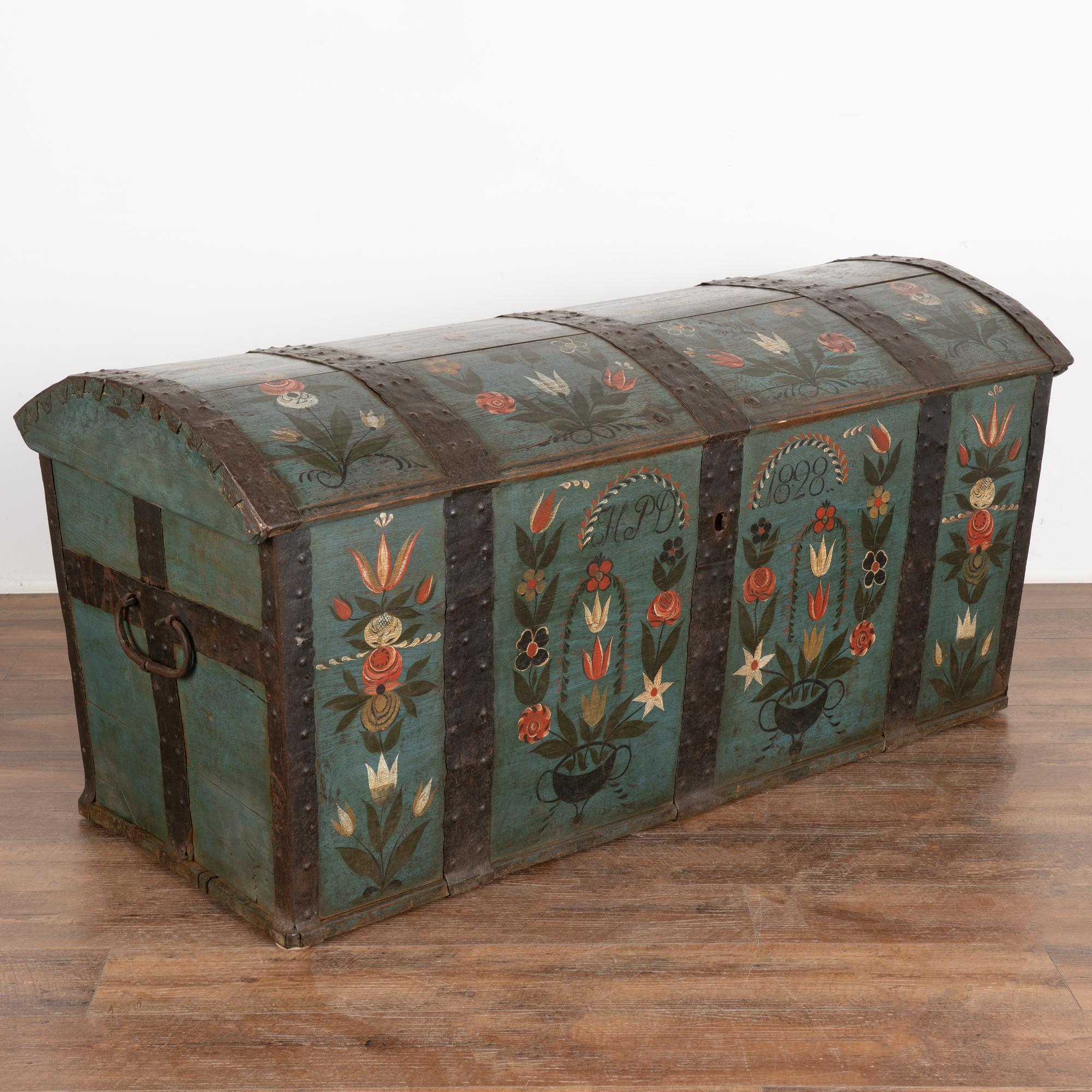 Original blue painted dome top oak trunk from Sweden with traditional hand-painted details include floral motif along top and front.
Monogram of HPD and date 