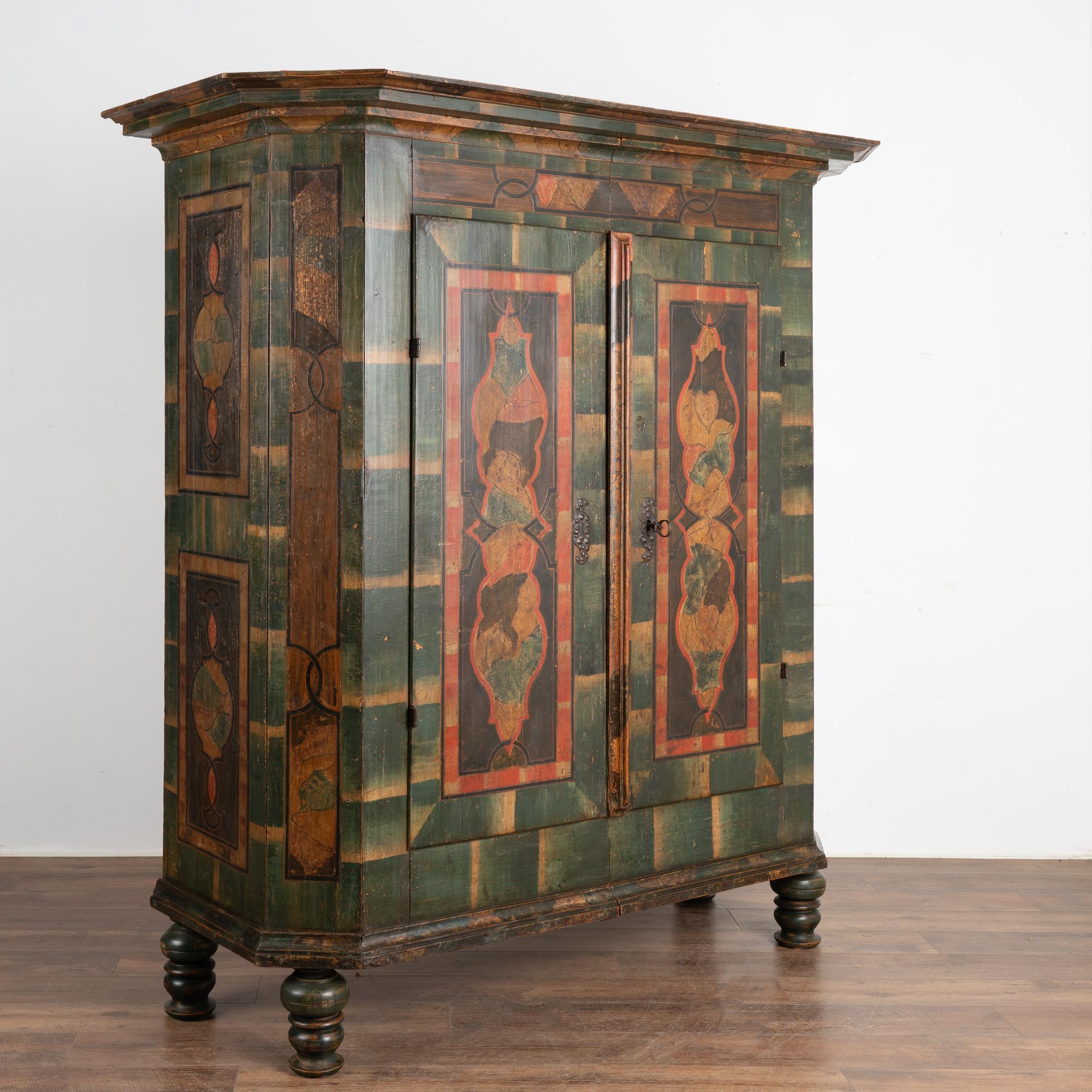 This remarkable painted armoire still maintains the quality and details of the original green hand-painted finish. Please enlarge photos to appreciate the rich colors and unique patterns which are beautifully executed.
Impressive painting continues