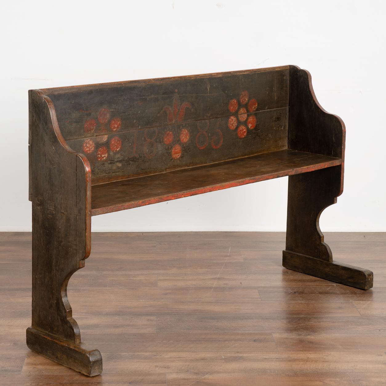This narrow bench is a fun find due to its unique smaller scale at just over 4.5' long, perfect for a small mud room, entryway or hallway.
Original hand painted details include red flowers, date of 1883 and overall dark brownish green background.