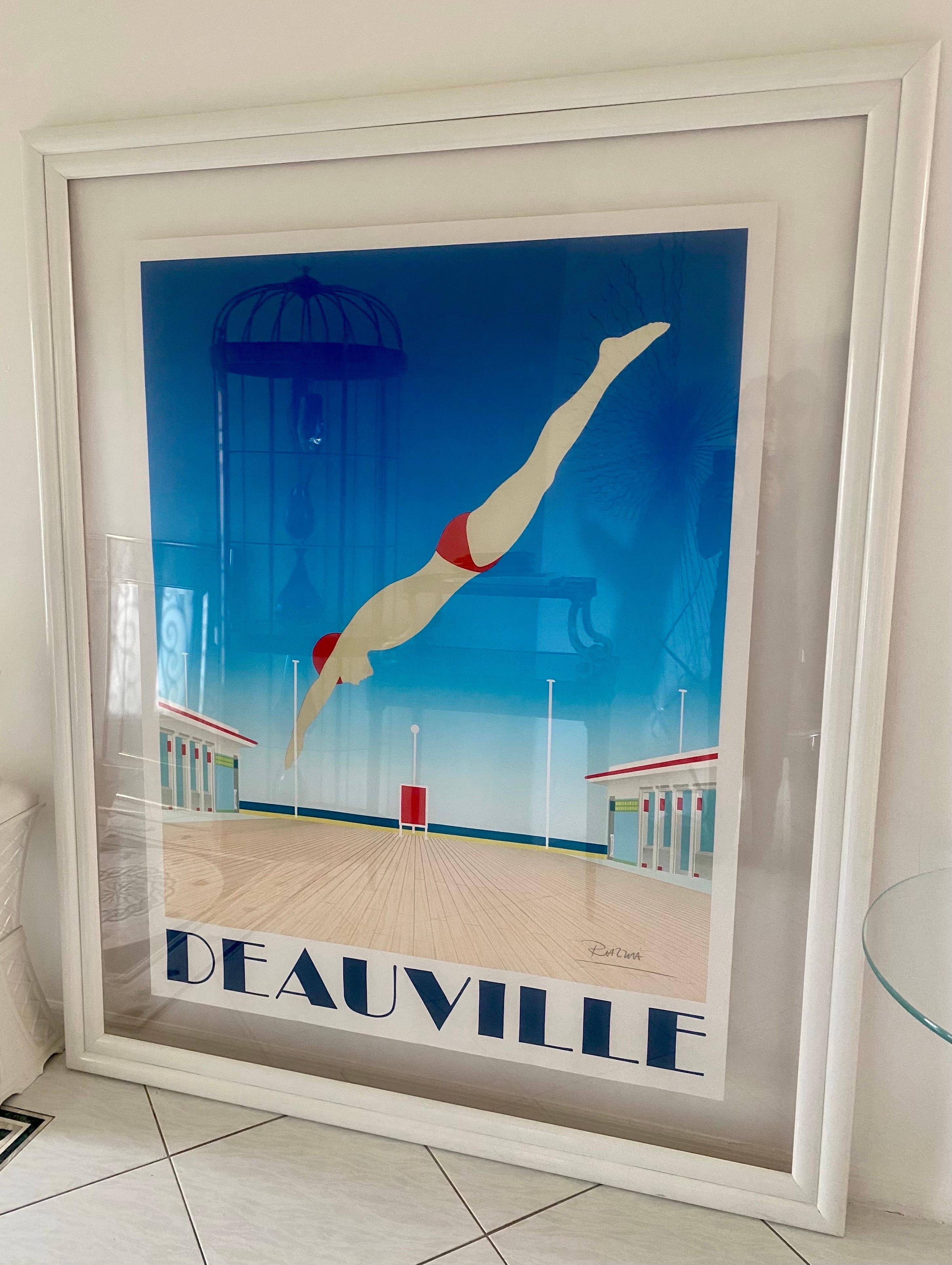 An original hand signed lithograph poster with linen backing by Gerard Courbouleix Deneriaz in custom made frame of museum quality acrylic and white lacquered wood. Poster measures 46.5 inches wide by 60 inches high. See listed measurements for