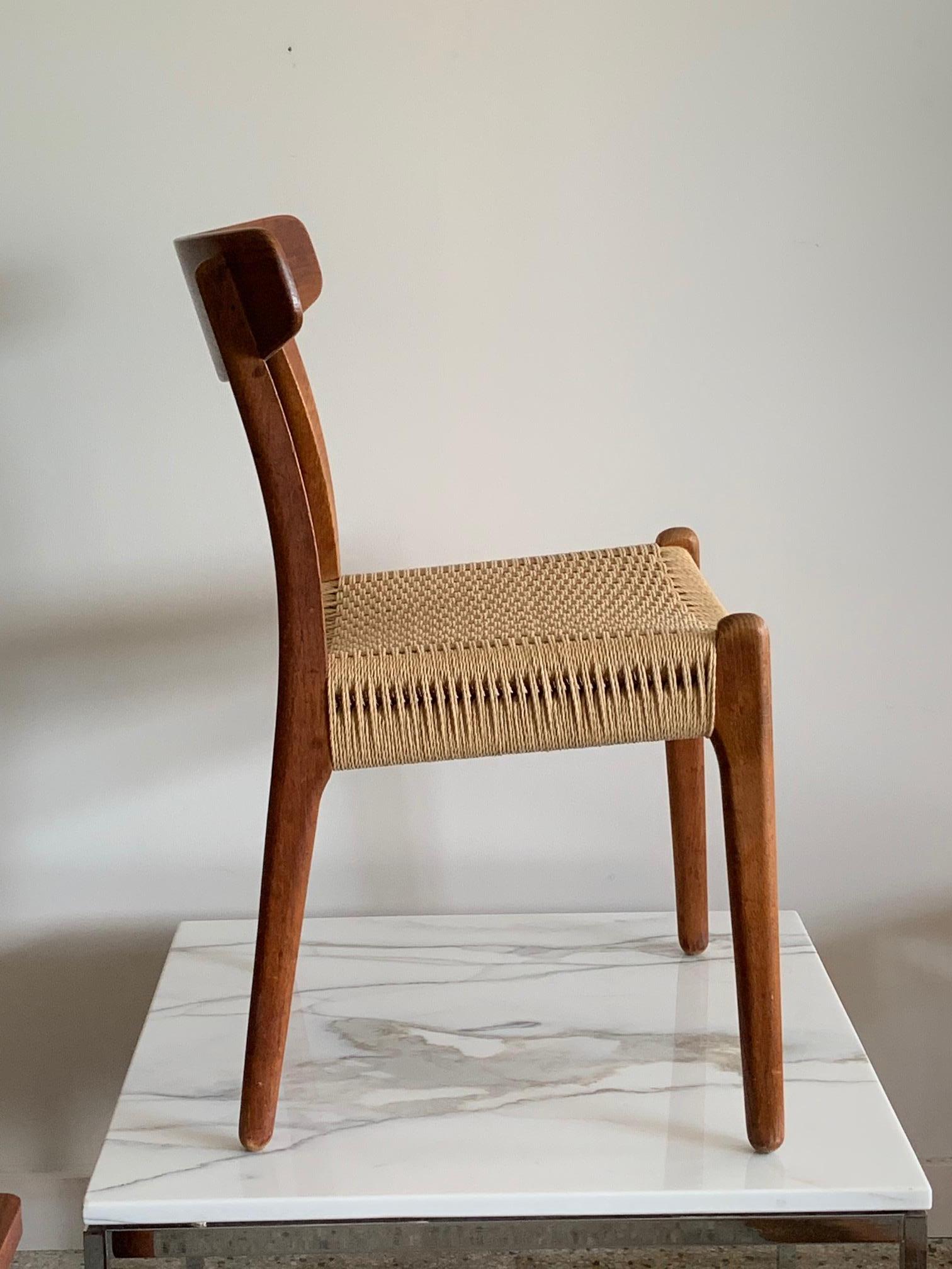 A Classic and beautiful, vintage Hans Wegner CH 23 chair made of teak and oak, with cord seat. Great patina and character which you cannot get with new chairs. Perfect as a desk chair or occasional chair. Manufactured by Odense, Denmark, circa 1960s.