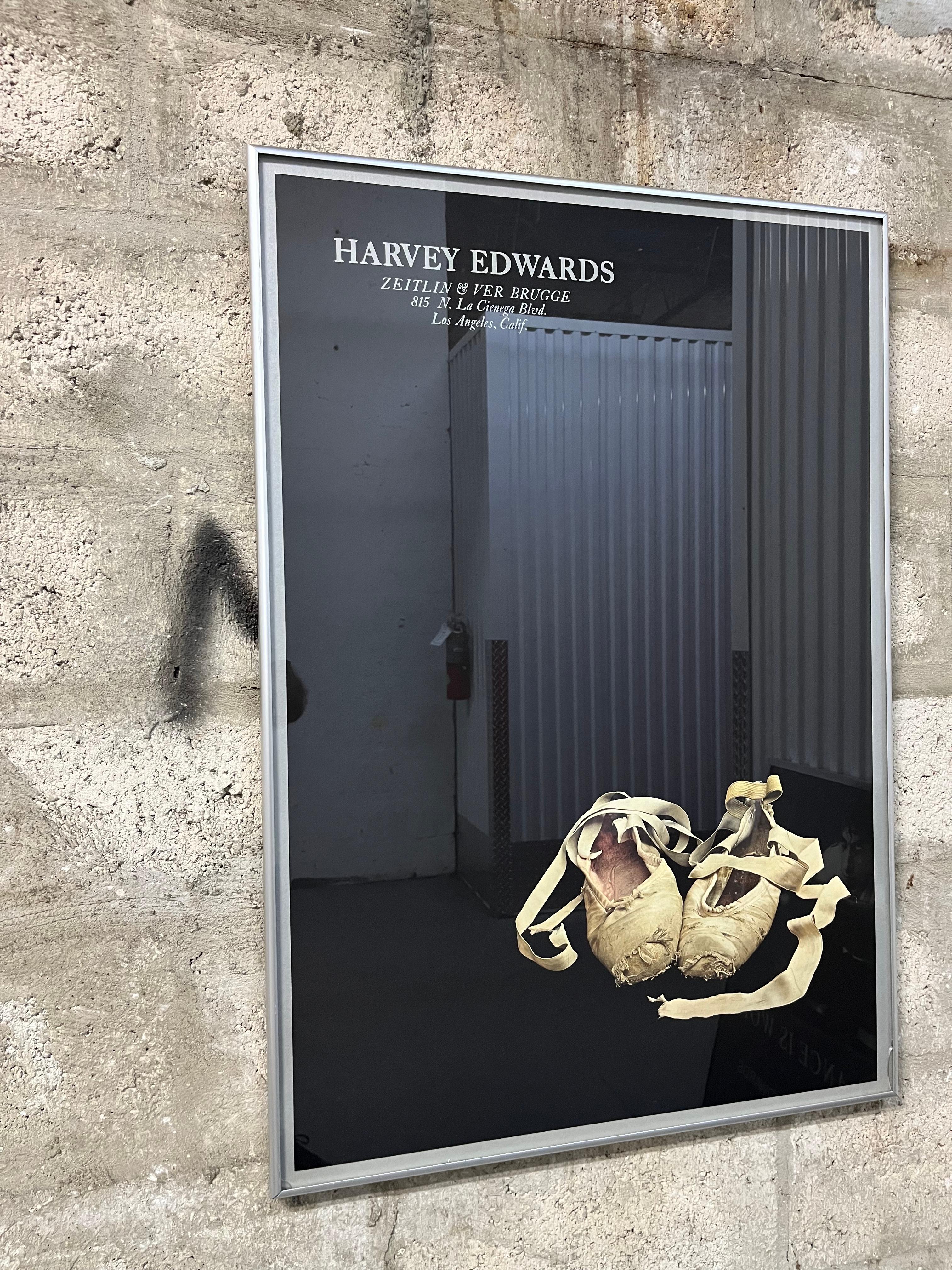 Original Harvey Edwards Zeitlin & Ver Brugge Rare Books Store Framed Exhibition Poster. 1979
Features a monochromatic image of a pair of distressed ballet shoes on a solid black background framed with an aluminum and protected with a glass. 
In good