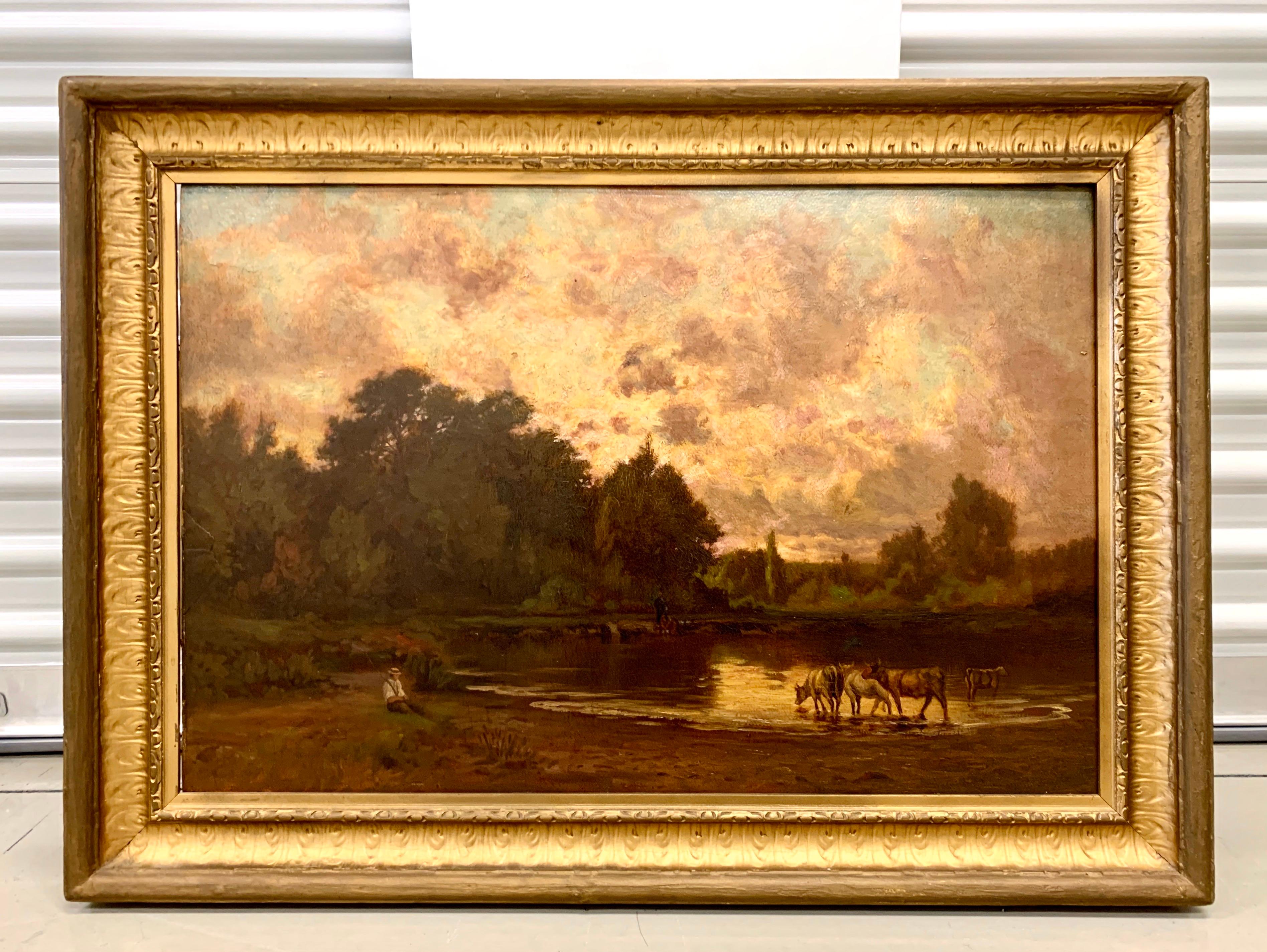 Beautiful pastoral landscape oil painting with cows on a river beneath a purple sky. Oil on board. Signed on back along with provenance. Displayed in a gold giltwood frame, late 19th century.