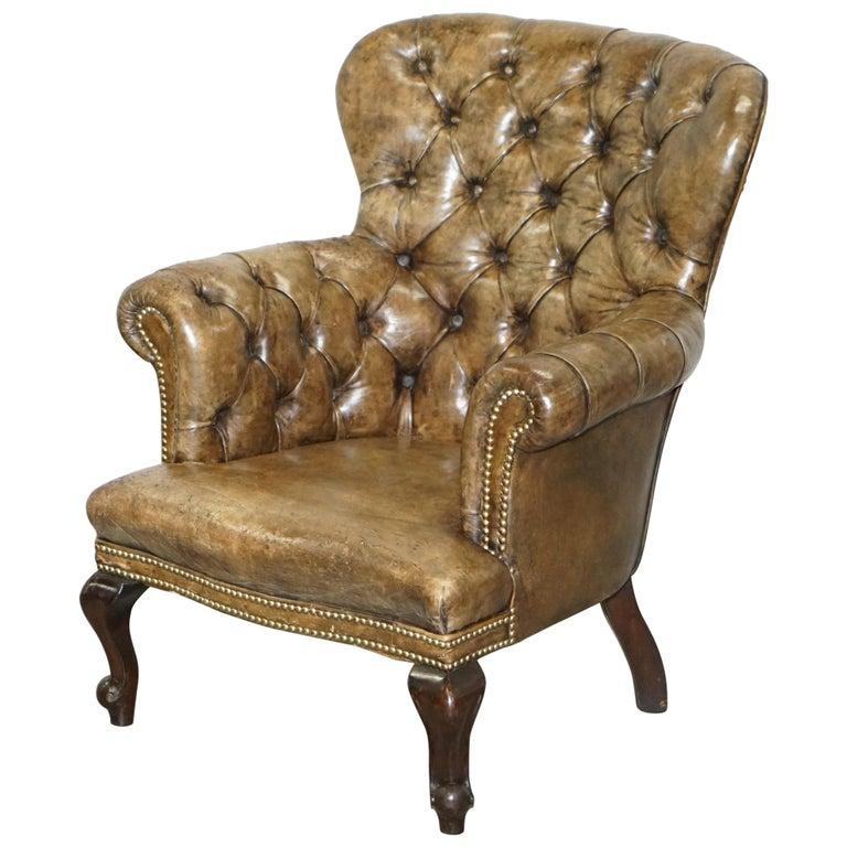 We are delighted to offer for sale this lovely original Regency circa 1810-1820 Chesterfield distressed leather library reading armchair

This is a very decorative piece, the leather color is to die for, luxury furniture restorers have been trying