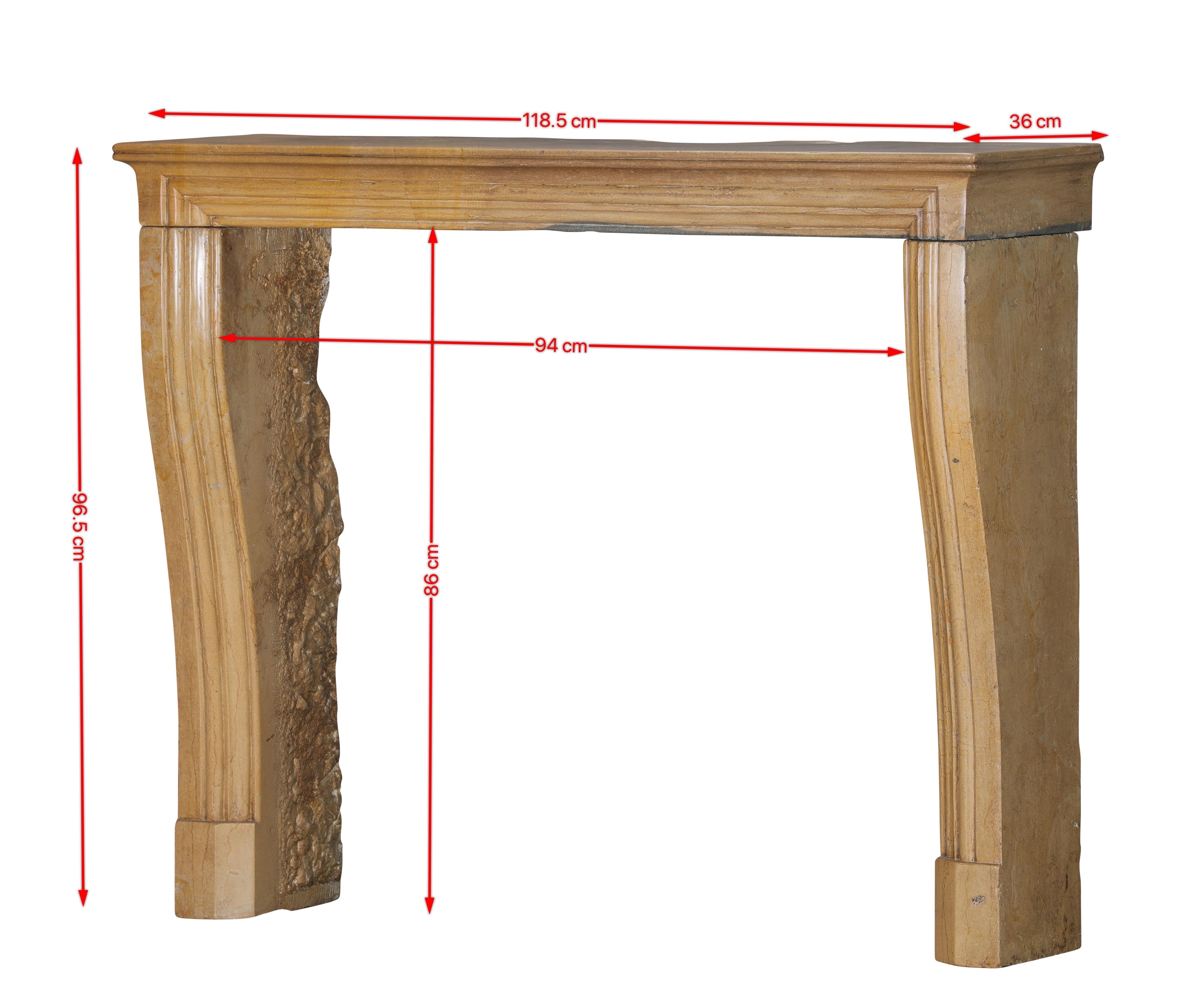 This authentic Louis XIV-style fireplace surround is a stunning expression of French architectural refinement, carved from hard Corton stone — a prized limestone renowned for its warm tonality and durability.
The stone’s beautiful bicolor