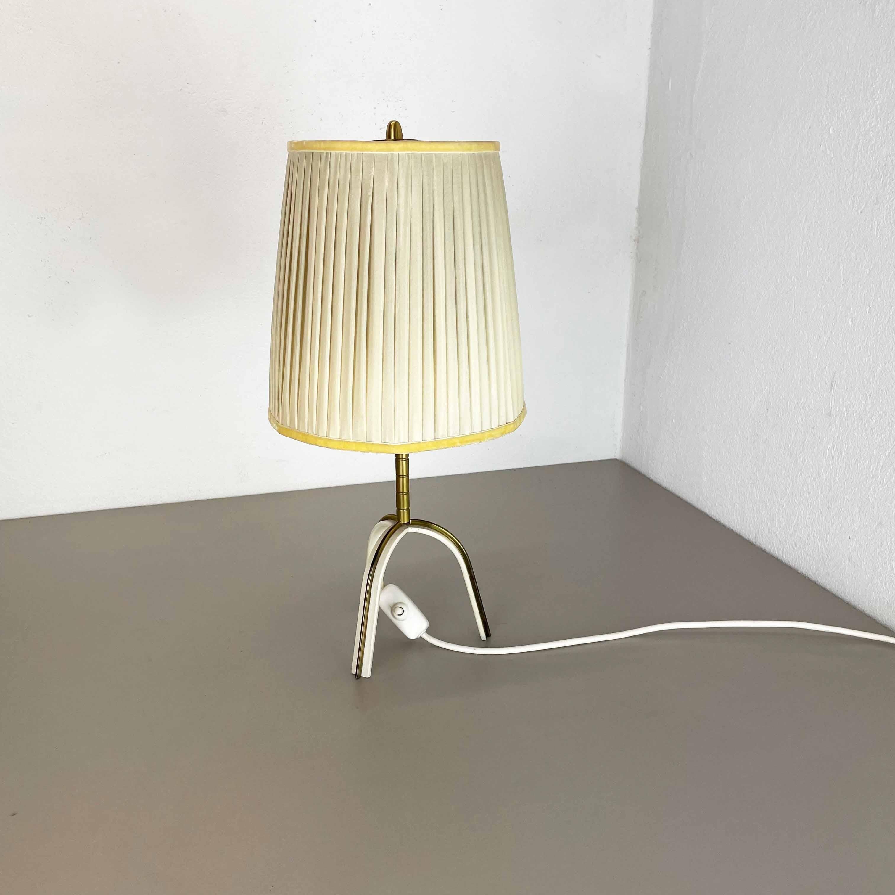 Article:

Tripod table light


Origin:

Austria


Age:

1950s


This original vintage tripod table light was designed and produced in the 1950s in Austria. The super rare and Minimalist tripod Stand element is made of metal and brass.