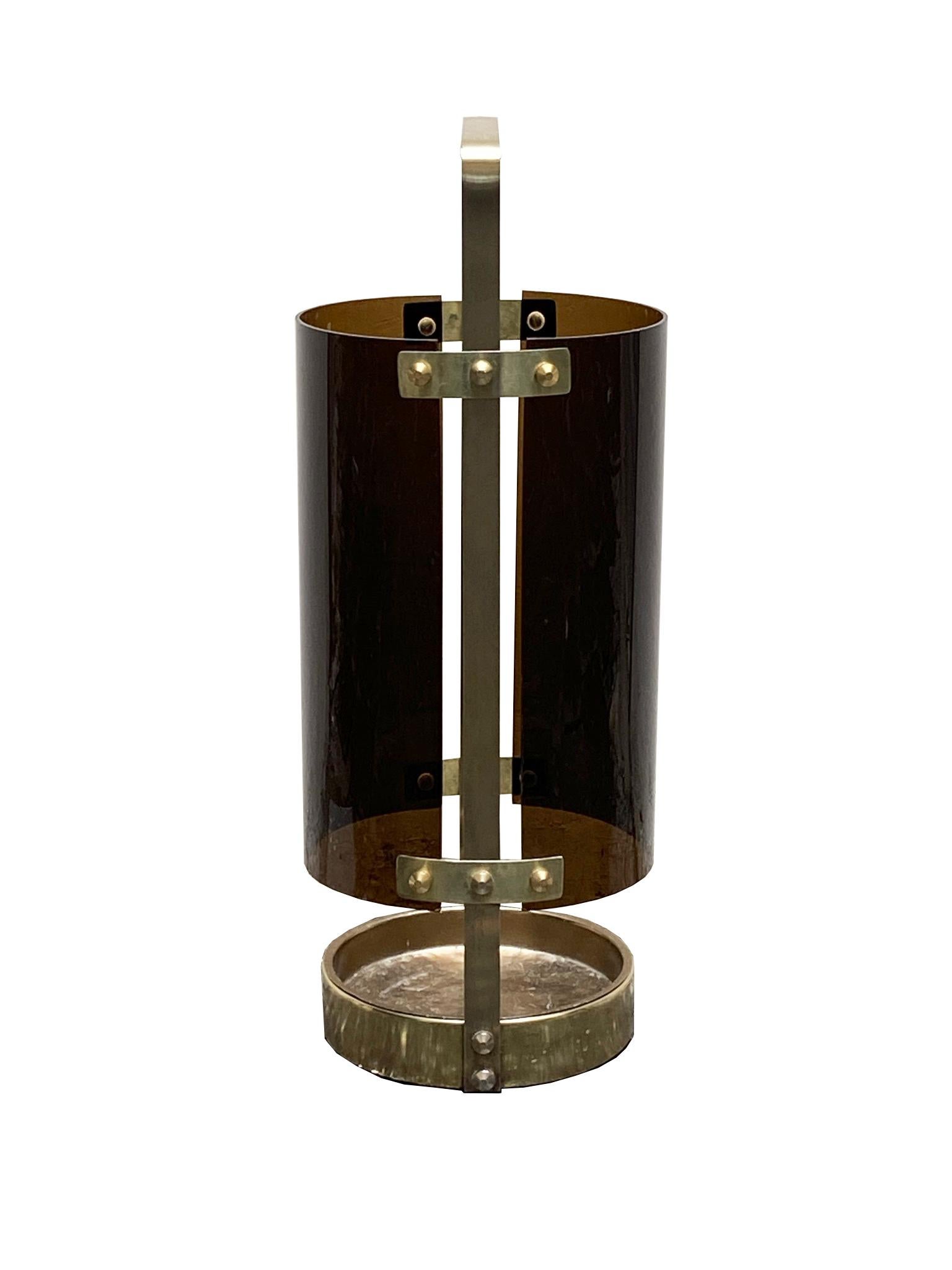 This original vintage Hollywood Regency umbrella stand was produced in the 1970s in Italy. The middle part for holding the umbrella is made of acryl plastic glass. At the bottom the item has a water dipping shell element. As the element is made of