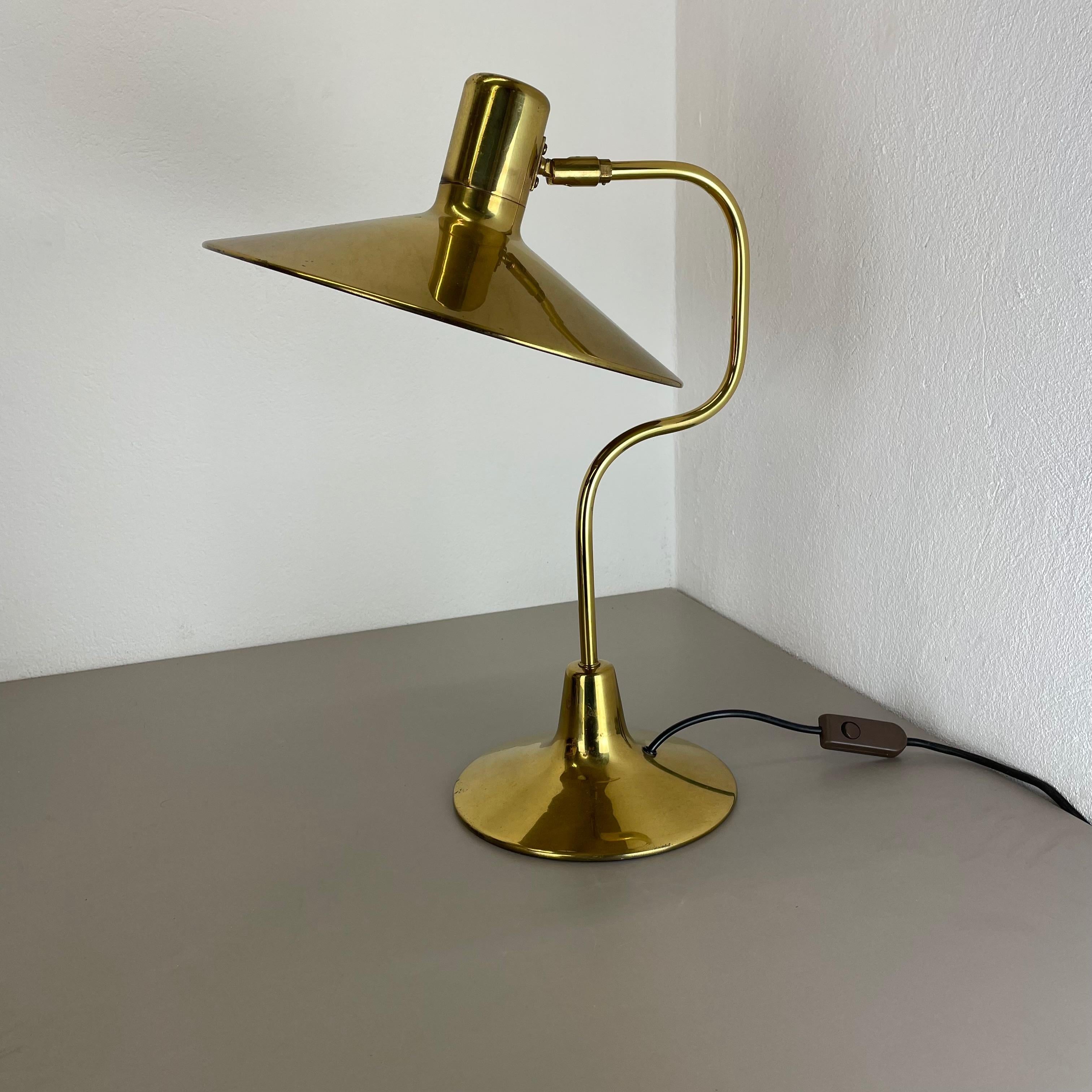 Article:

modernist brass table light 


Origin:

Italy


Decade:

1970s





This original vintage light was designed and produced in the 1980s in Italy. The light is made of brass and has a witch hat formed shade element which