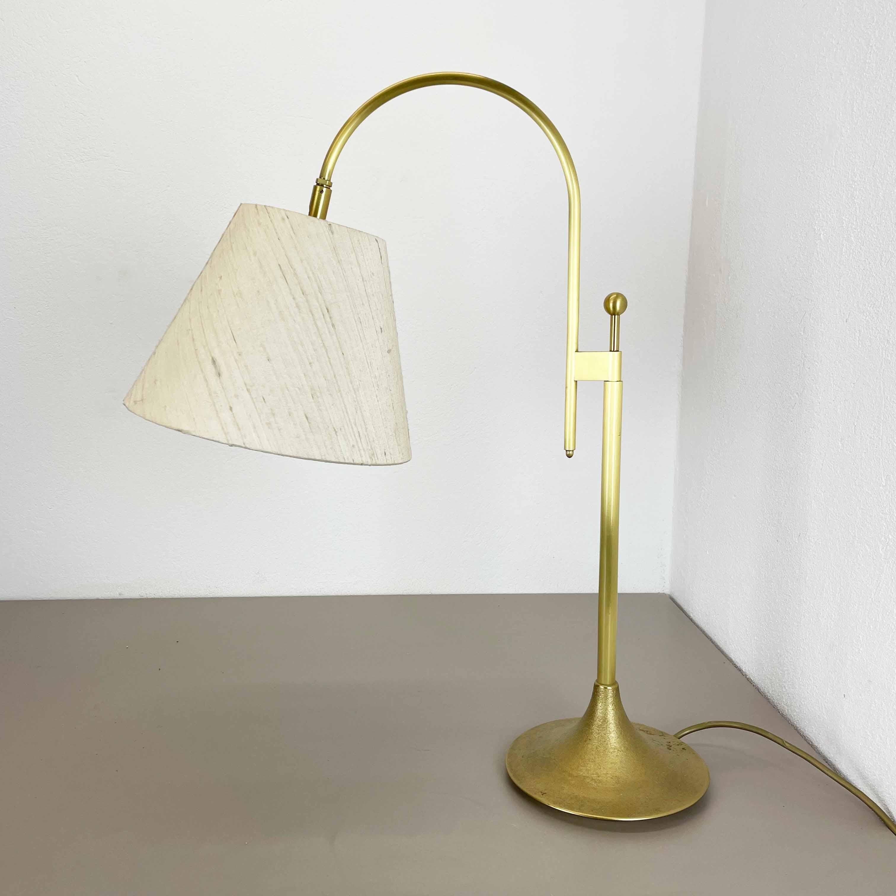 Article:

Modernist brass table light 


Origin:

Italy


Decade:

1970s





This original vintage light was designed and produced in the 1970s in Italy. The light is made of brass and has a wild silk hat formed shade element