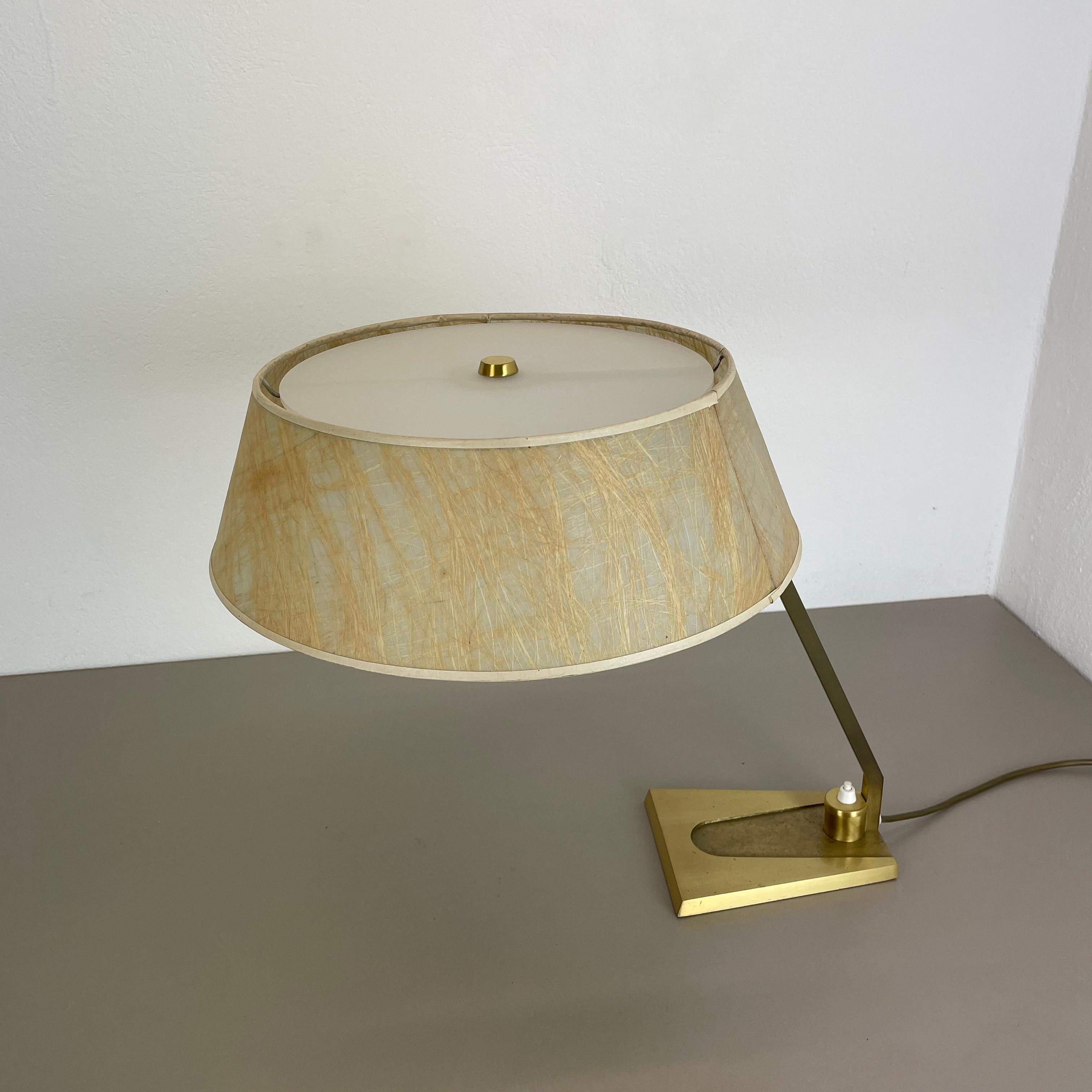 Article:

modernist brass table light 


Origin:

Italy


Decade:

1970s



This original vintage light was designed and produced in the 1970s in Italy. The light is made of brass with a nice formed elegant hollywood regency style