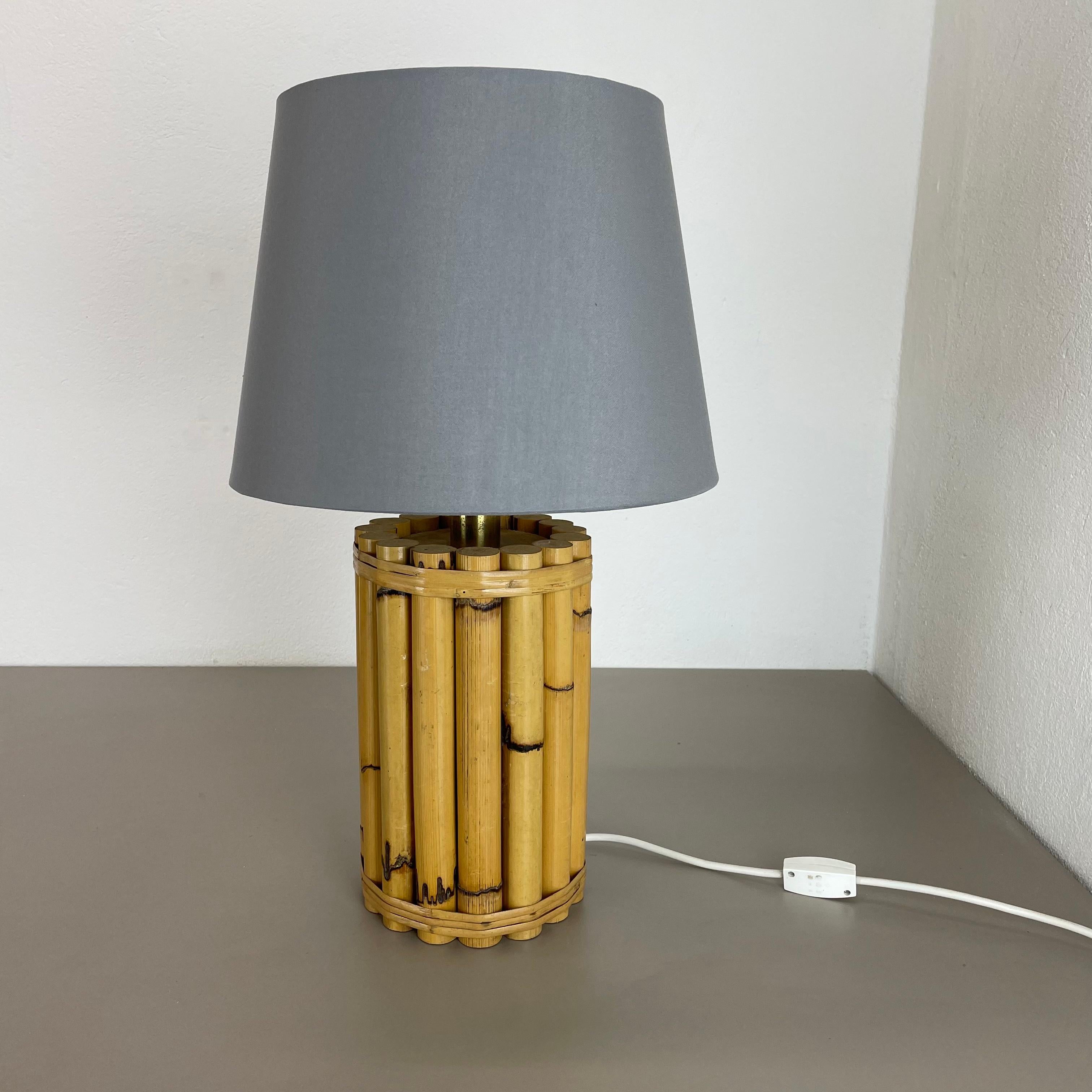 Article:

modernist bamboo table light 


Origin:

Italy


Decade:

1970s



This original vintage light was designed and produced in the 1970s in Italy. The light base is made of bamboo with a nice brass element on the top with
