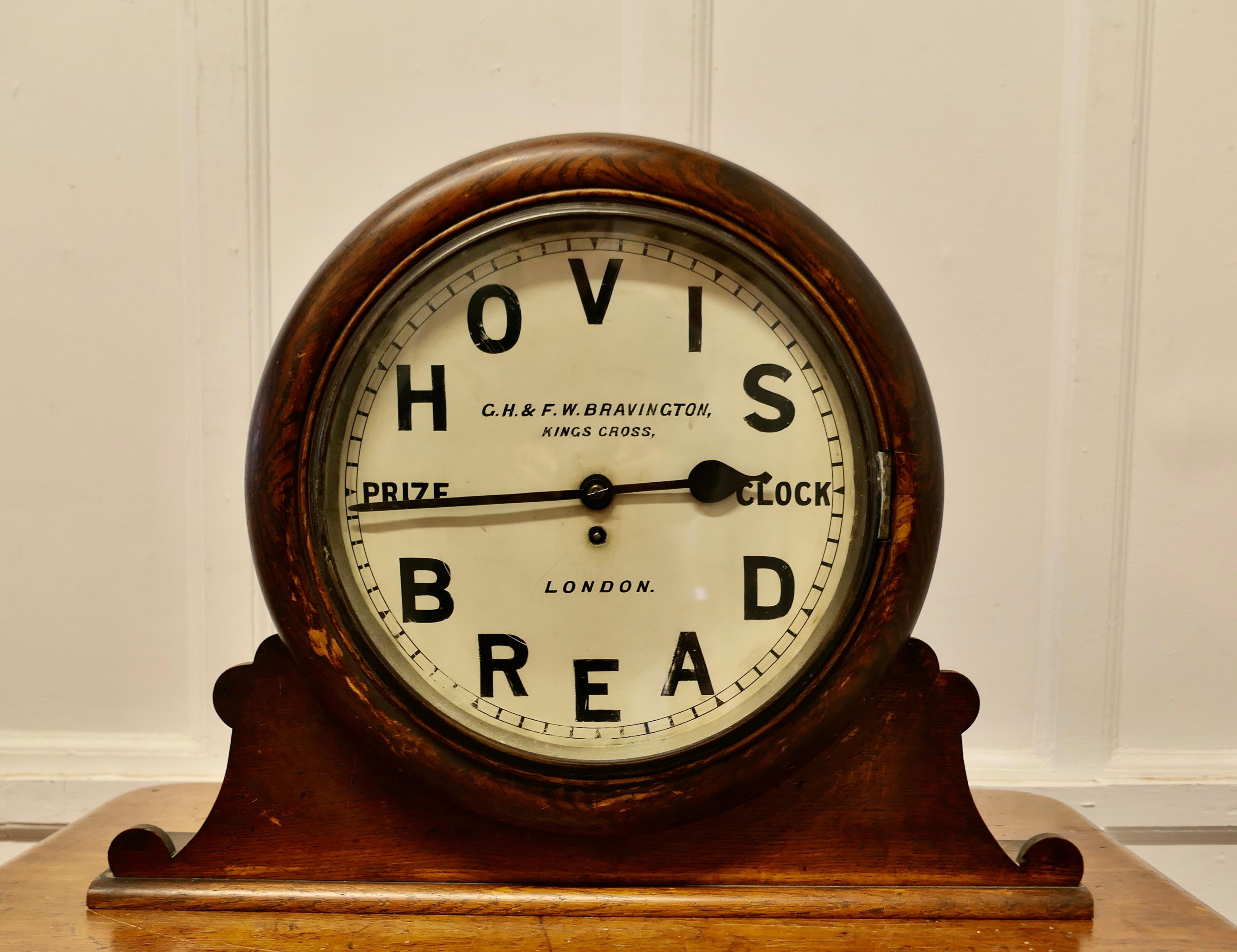 Original HOVIS Prize Clock by G.H.& F.W. Bravington London

Clocks like this one were won by Bakery shops and presented by Hovis, this was a very prestigious award for the recipient
Made by Bravingtons and Designed as a Wall Clock this on is