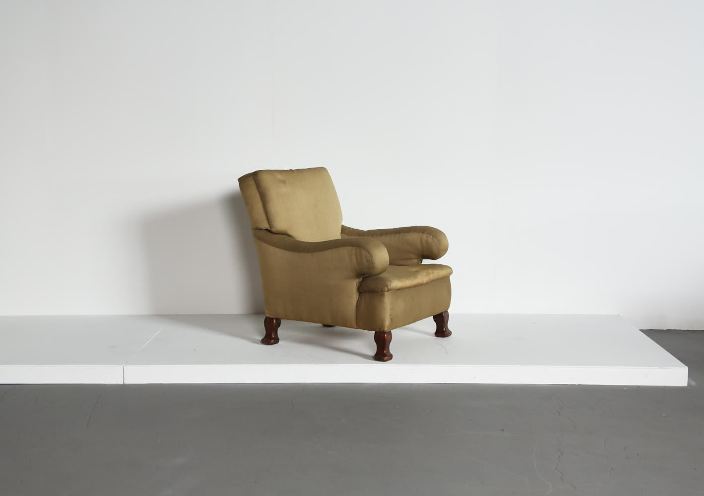A wonderfully shapely Howard & Sons era armchair, England, 19th Century.  Fabric is somewhat worn so this chair is sold for reupholstery.  Fast shipping worldwide.