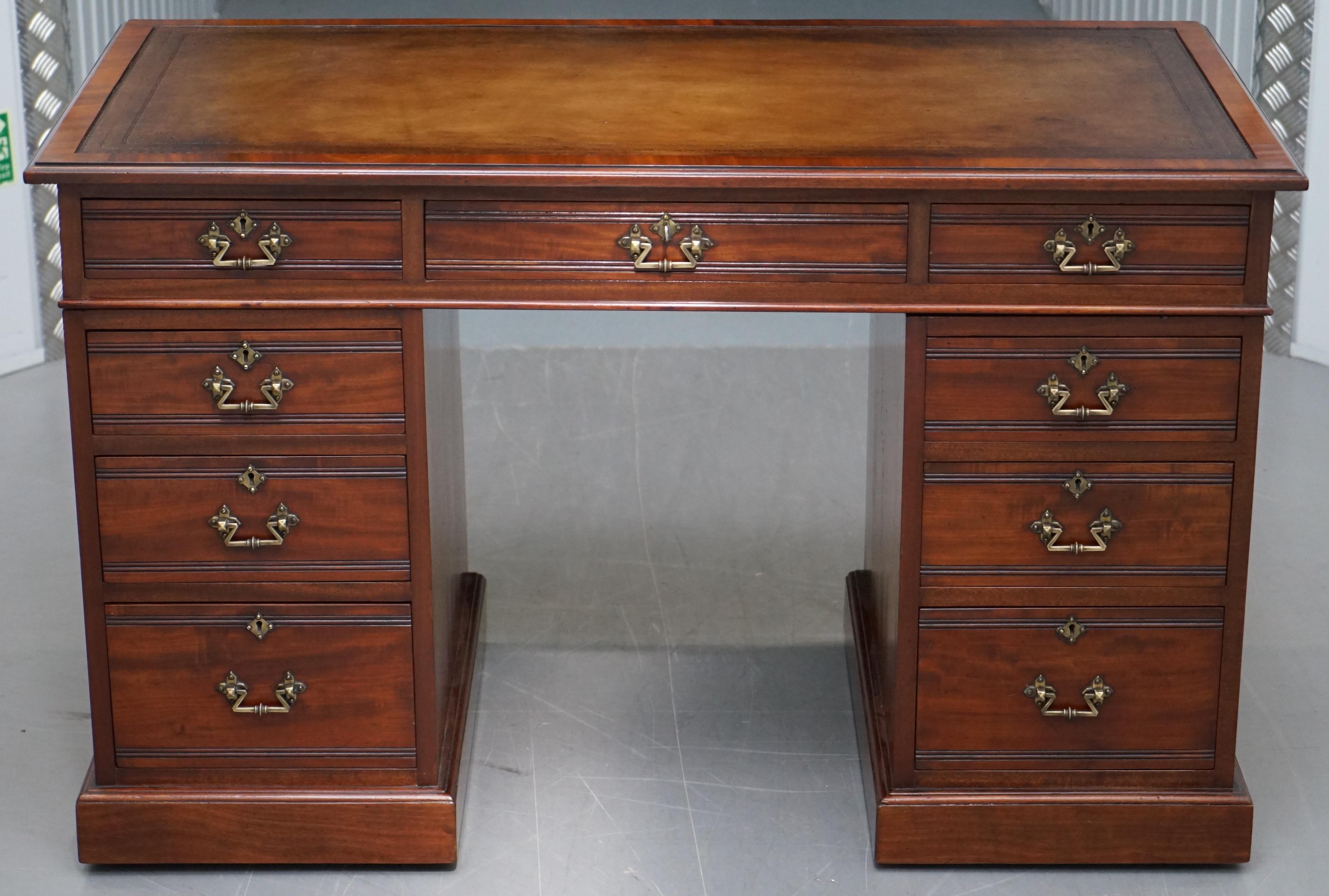 We are delighted to offer for sale this lovely handmade in England by Howard & Son’s of Berners Street London twin pedestal partner desk with hand dyed brown leather top

A very good looking and well made desk, it has the original Howard serial