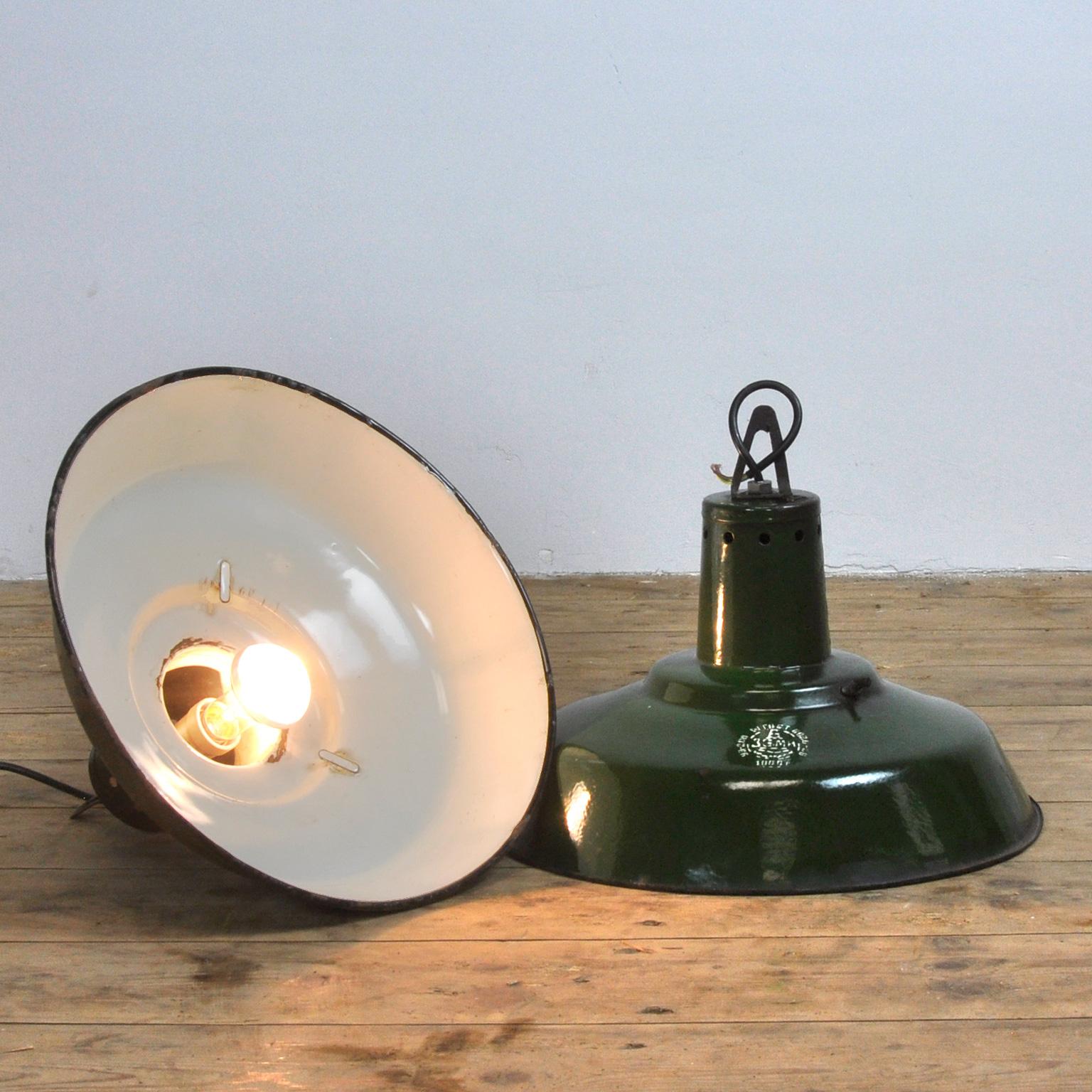 Eastern Bloc industrial pendant lamp. Comes from Hungary.
The lamp is rewired. Green enamel, white interior.
1 piece available. Price is per 1 piece.