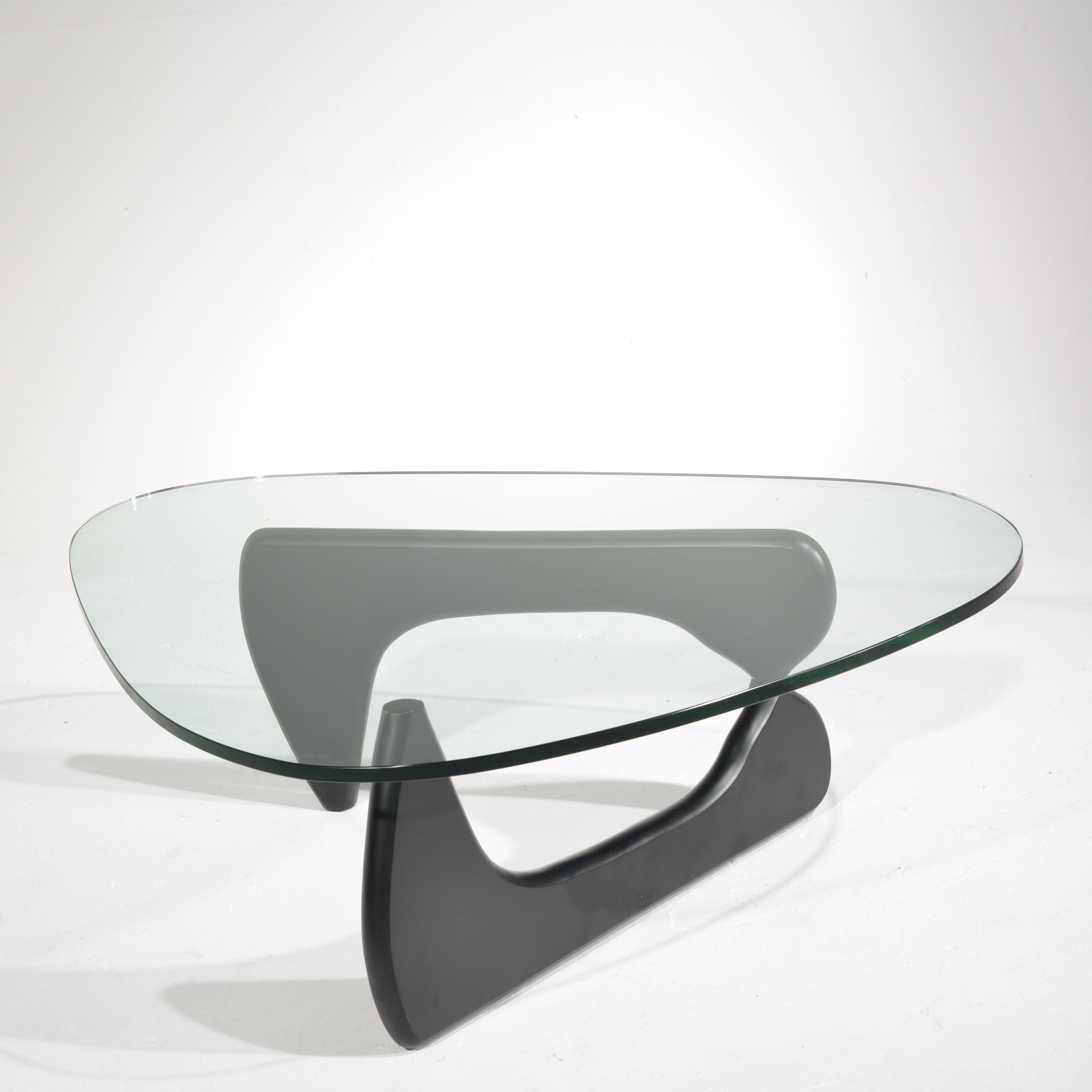 Isamu Noguchi designed coffee table with original glass top by Herman Miller.
An iconic midcentury design.