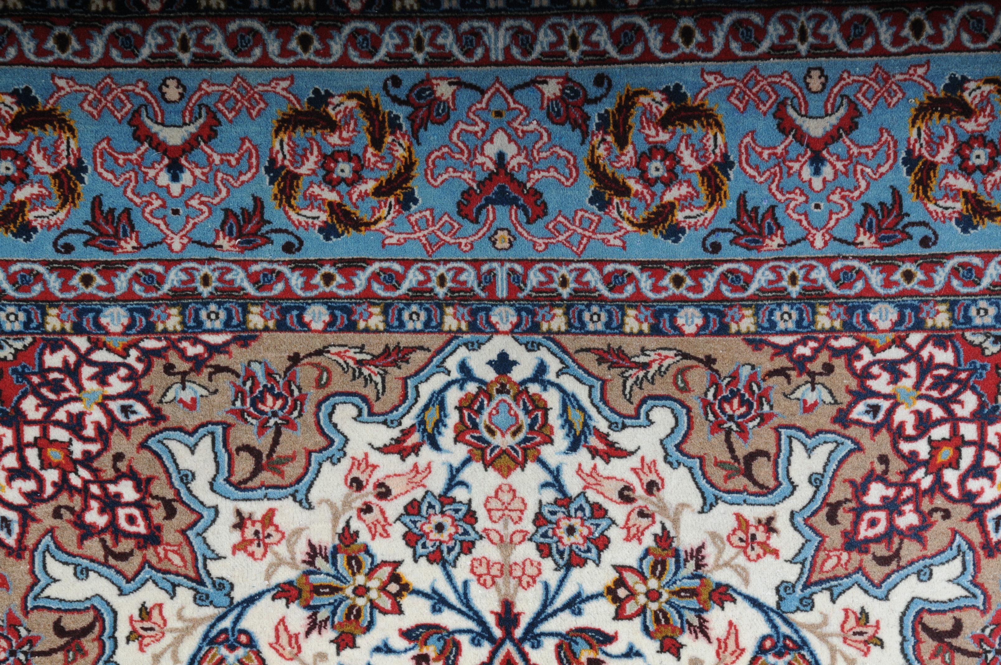 Original Isfahan carpet 20th century

Beautiful Isfahan carpet with mandalas.
Splendid colors characterize this symmetrically displayed and finely knotted carpet.
Brightly colored mirror with field-filling matching oval medallion and