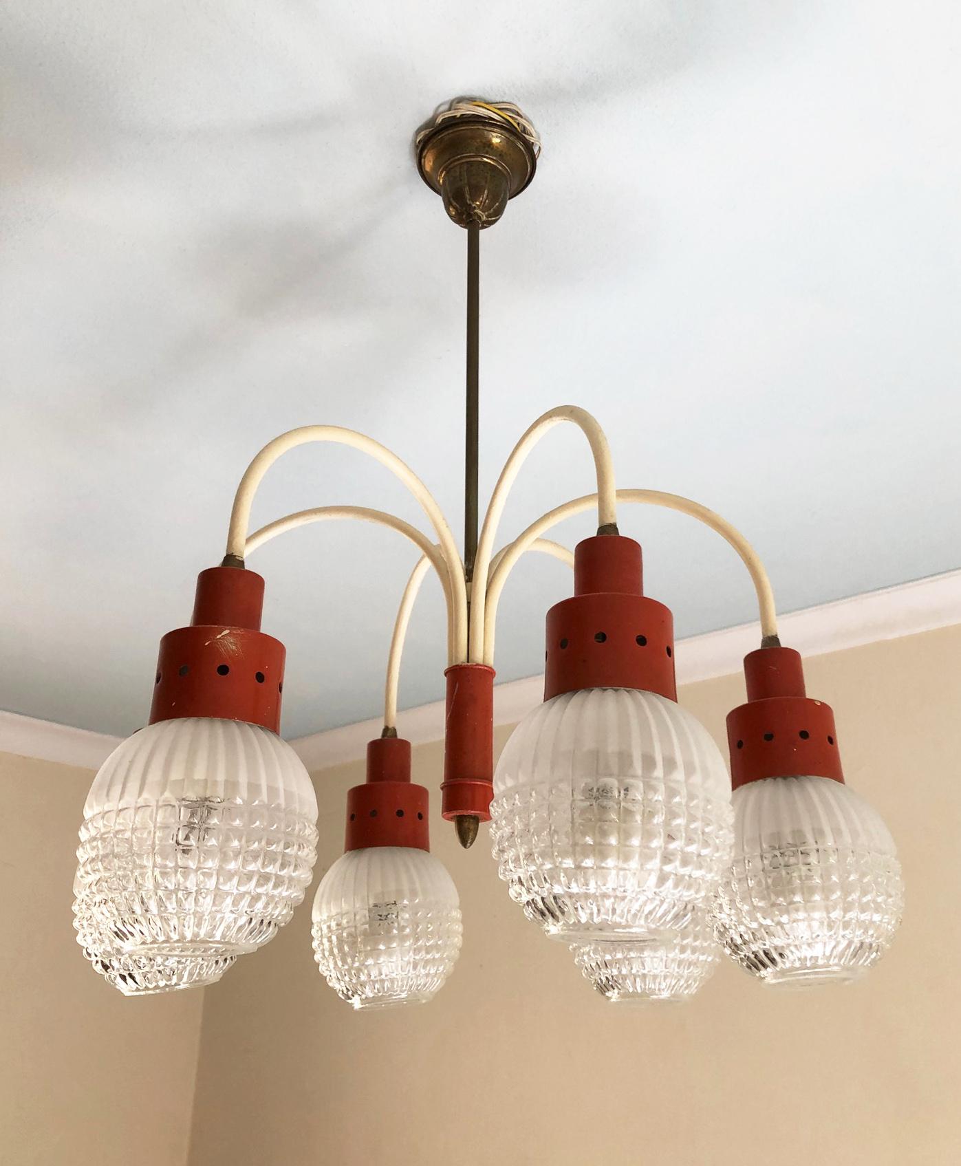 Original Italian chandelier from 1970s with six lights, orange and cream color
In working condition.
Equipped with original 20th century European wiring.
We recommend buyer consults an experienced electrician for proper installation.
The fixture