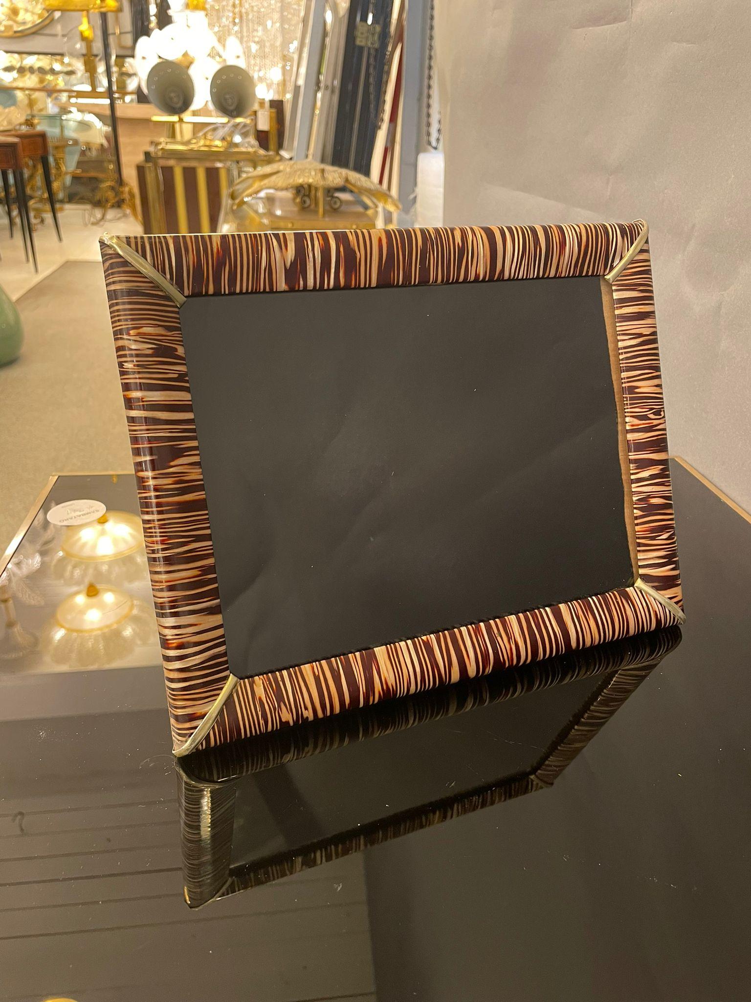An elegant picture frame highly decorative with brown and ivory zebra stripes. It can be used horizontally and vertically. Italy 1960s.