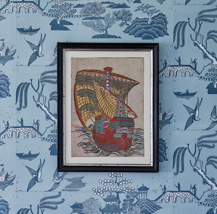 Lovely original Japanese woodblock print displaying a ship in clearly contrasted and vibrant colors. Paired with an antique frame.

During the second half of the 17th century, a new invention of woodblock printing in Japan allowed for the printing