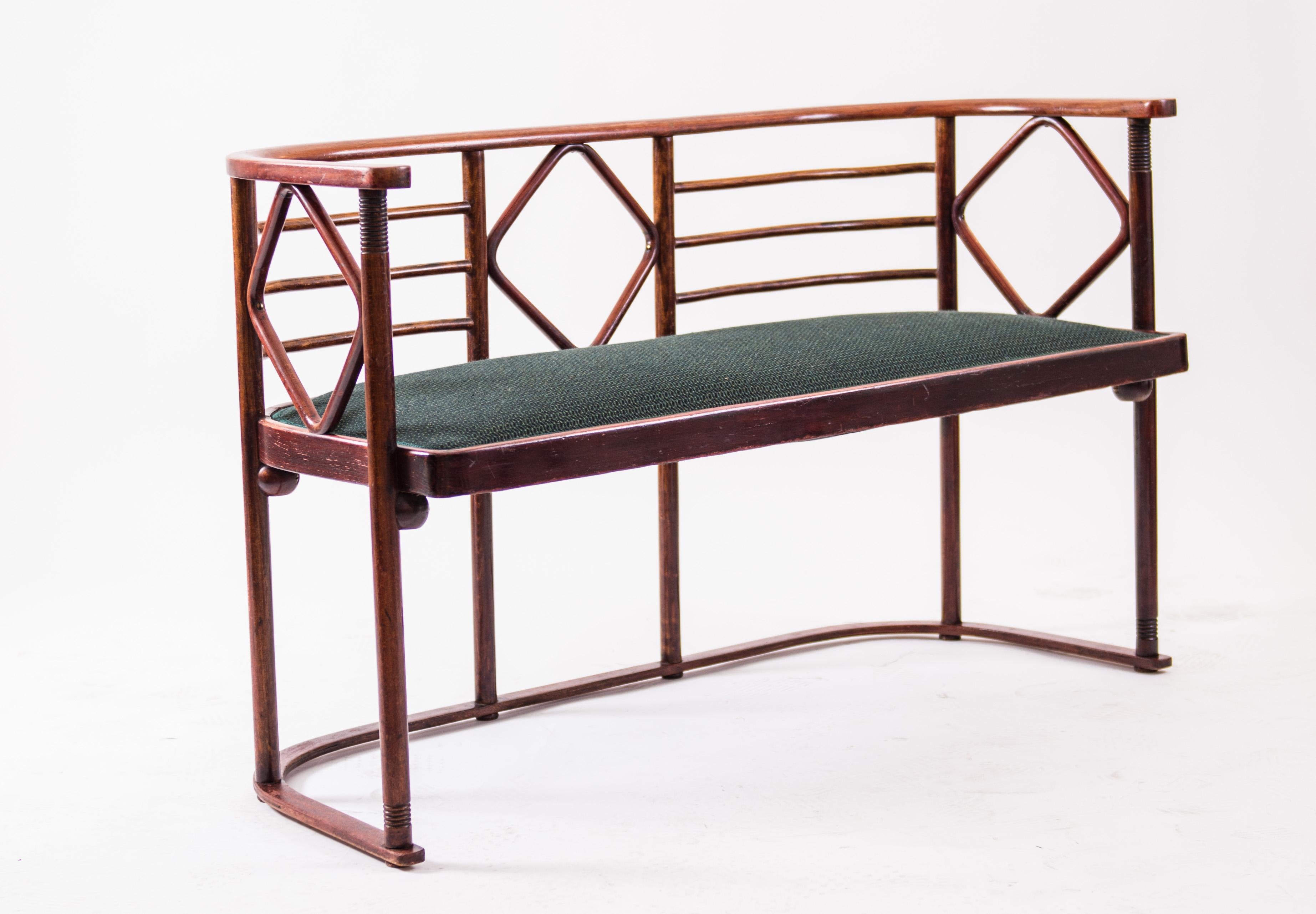 An extraordinary modern design from 1905, the time when Josef Hoffmann was on the zenith of his creativity, consisting of, two armchairs and a settee, beech bentwood, brown-stained, with polished finish, decorated with straight and rhomb-shaped