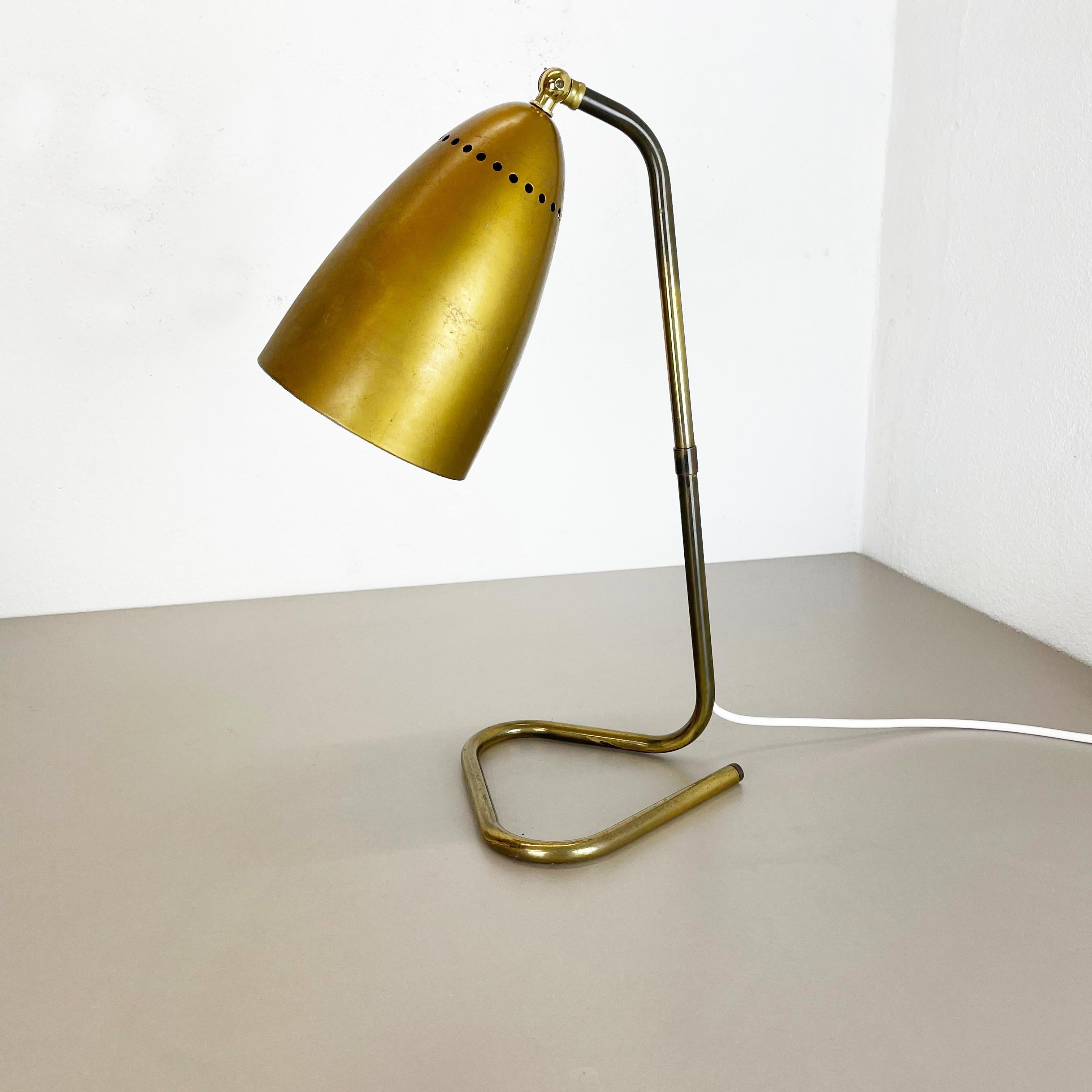 Article:

table light


Origin:

Austria


Age:

1950s


This original vintage table light was designed and produced in the 1950s in Austria. The super rare and Minimalist loop form stand element is made of brass. The light features