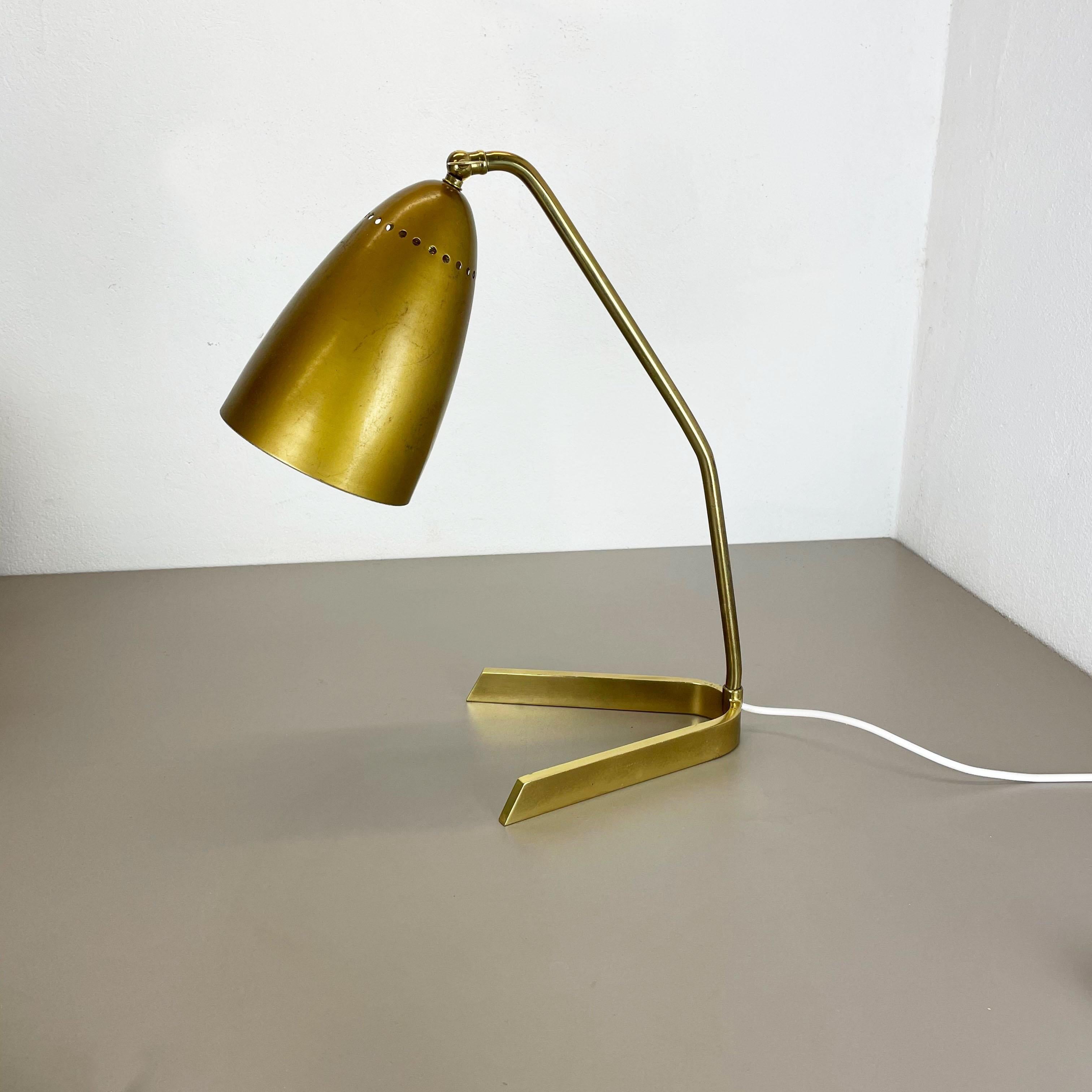 Article:

Table light


Origin:

Austria


Age:

1950s


This original vintage table light was designed and produced in the 1950s in Austria. The super rare and Minimalist V form stand element is made of brass. The light features its