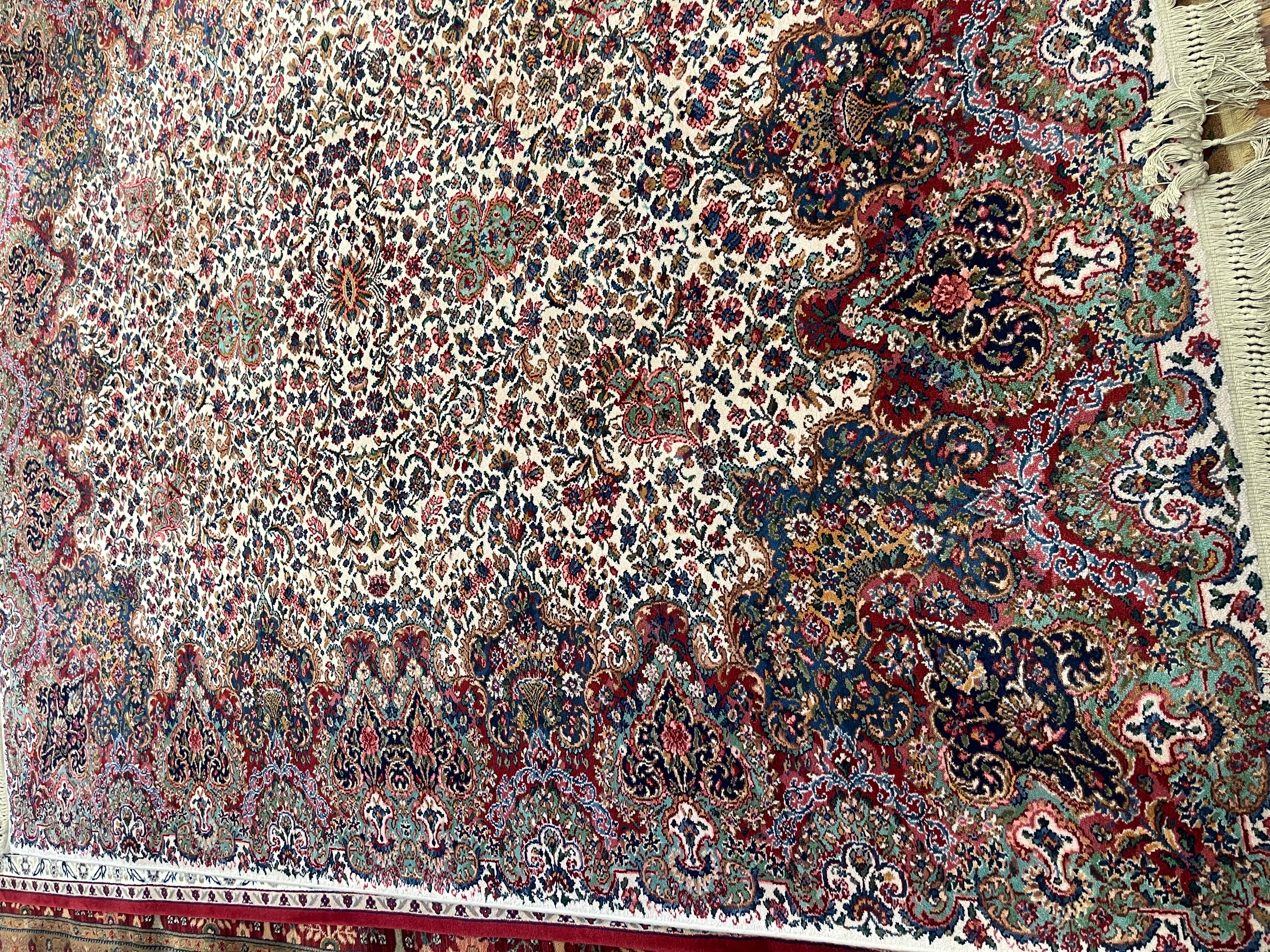 Magnificent Karastan Floral Kirman 100% worsted wool pile area rug measuring 8.8 by 10.6 and permanently moth and insect free.