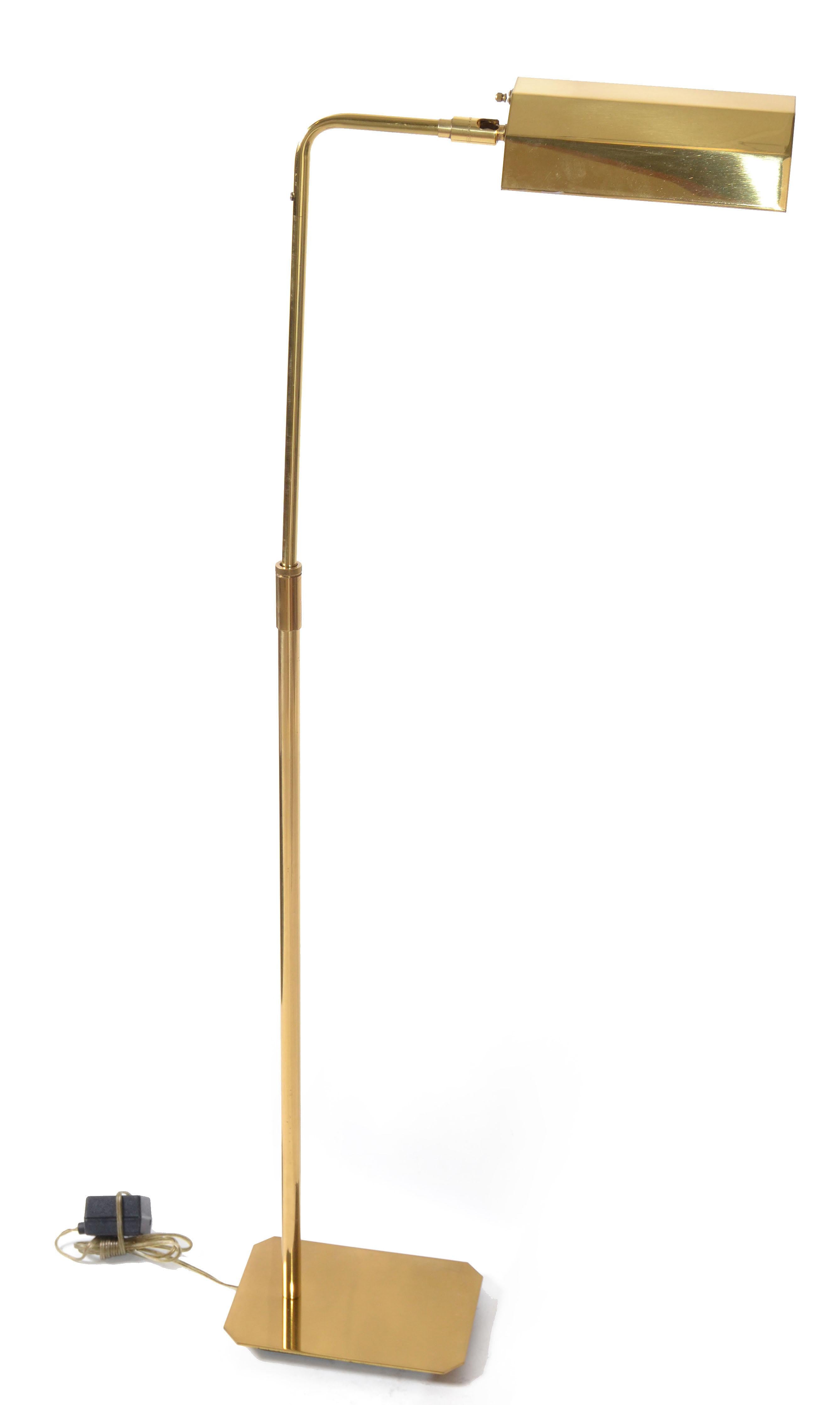 This polished brass floor lamp, was made by the esteemed American Company Koch & Lowy, that designed all forms of lighting, from table, to floor lamps, and chandeliers. 
It is best known and recognized by these floor lamps, that came in varying