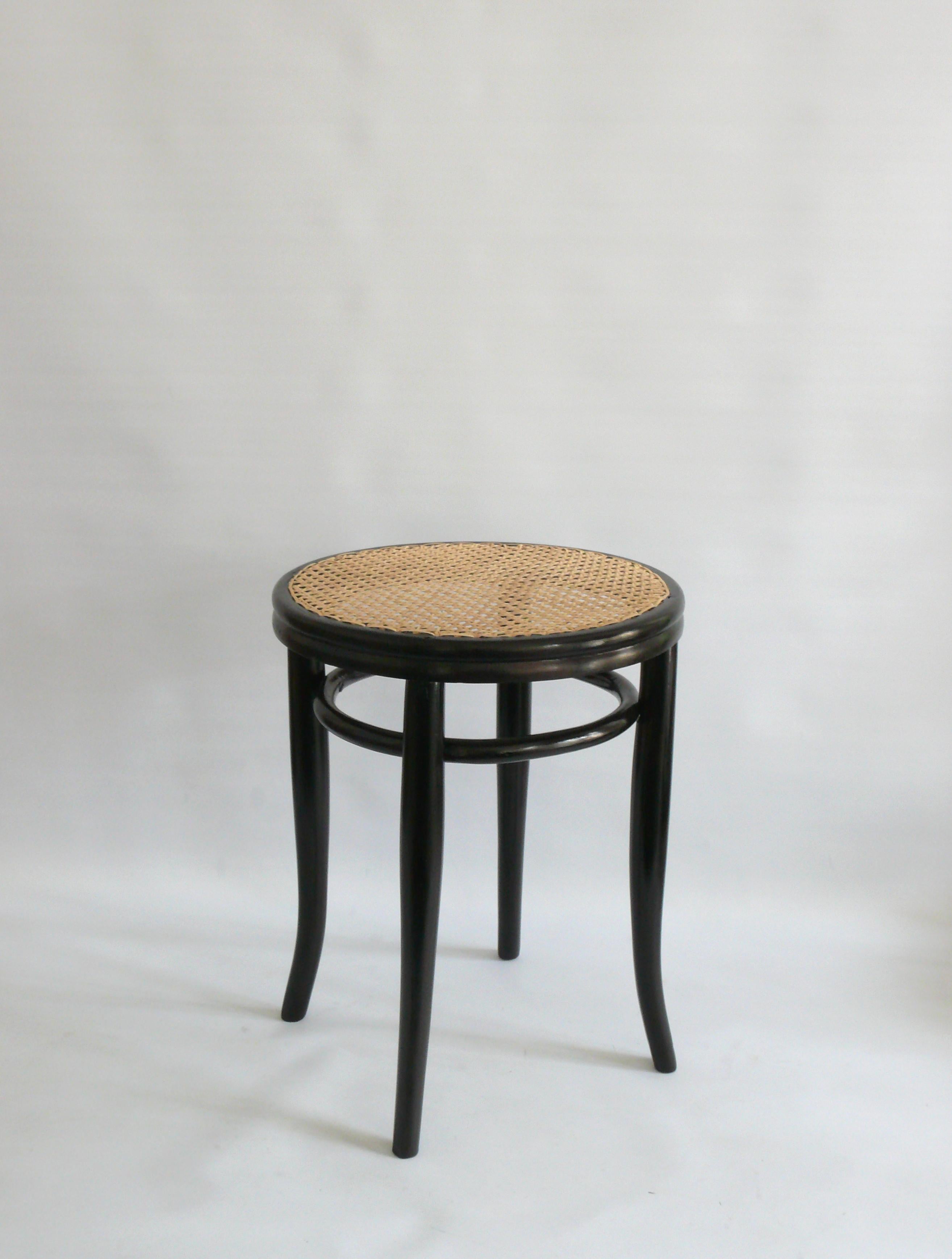 Original Kohn bentwood stool with Viennese weave from the end of the 19th or beginning of the 20th century from the J.&J company. Kohn, Austria. The stool is made of bent beech wood and has a second bentwood ring below the seat for stability.