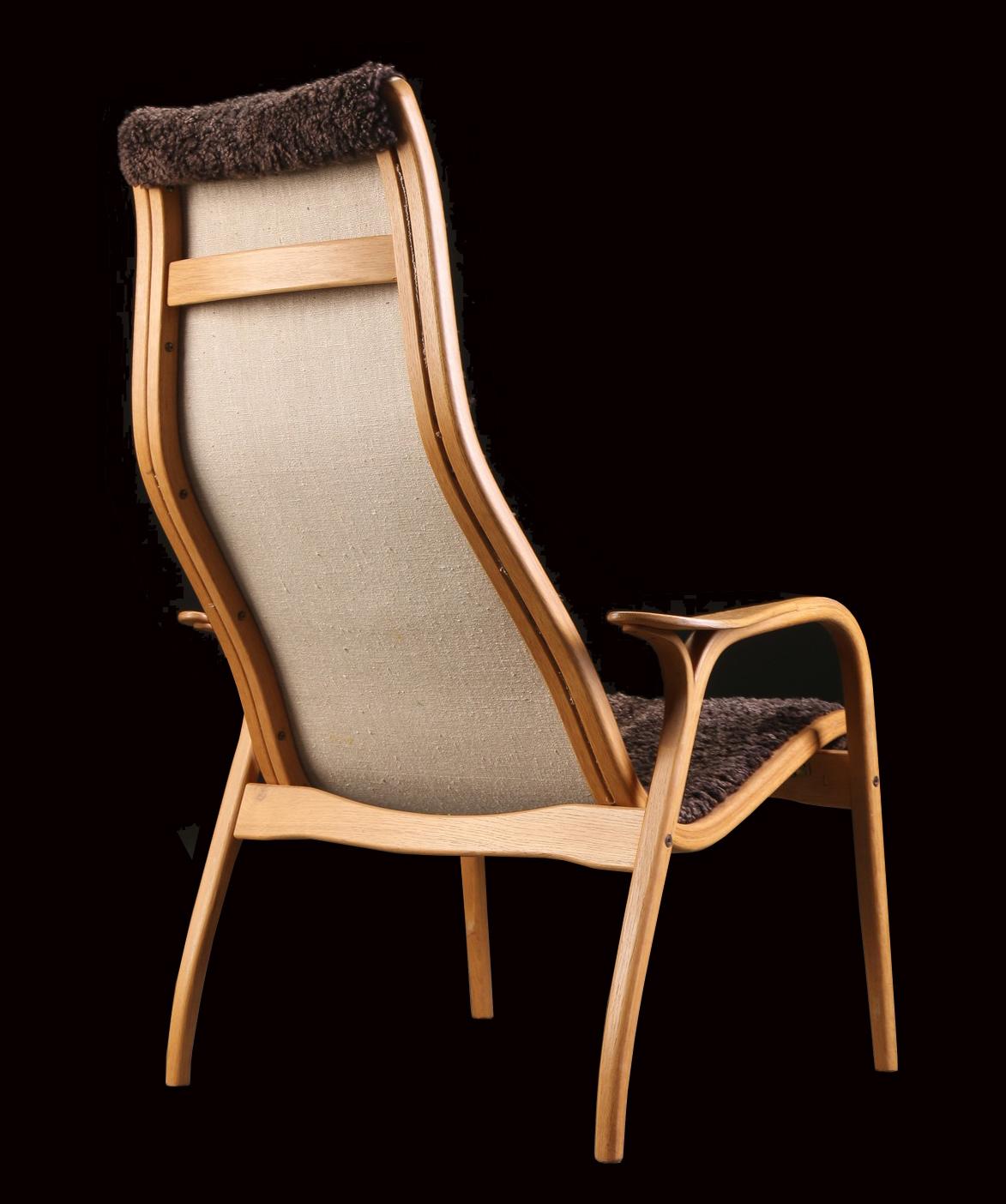 A very nice example of this super comfortable yet light armchair, designed by Yngve Ekstrom, made of laminated oak and sheepskin and in very nice original condition.