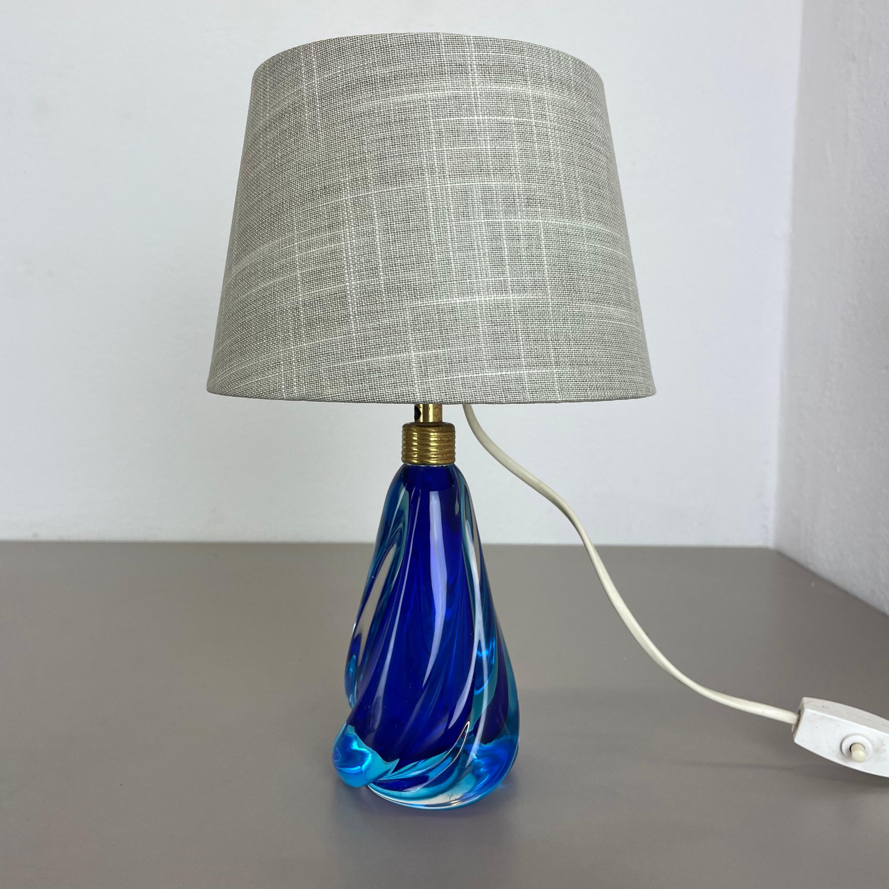 Article:

table light desk top light


Origina:

Murano, Italy


Age:

1960s




Description:


This fantastic vintage table light base was designed and produced in the 1960s in Murano, Italy. The light base is made of high