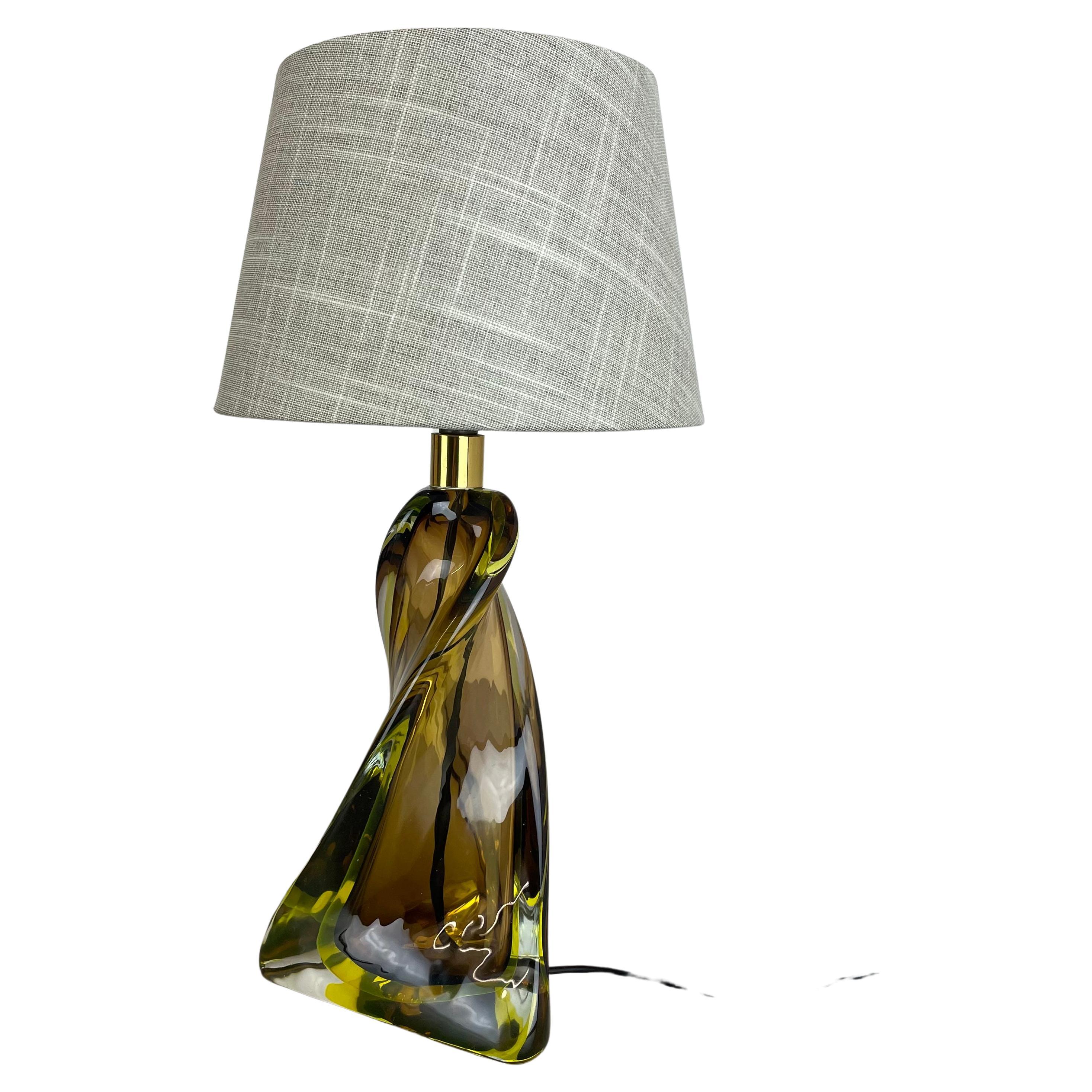 Article:

table light desk top light


Origina:

Murano, Italy


Age:

1960s




Description:


This fantastic vintage table light base was designed and produced in the 1960s in Murano, Italy. The light base is made of high
