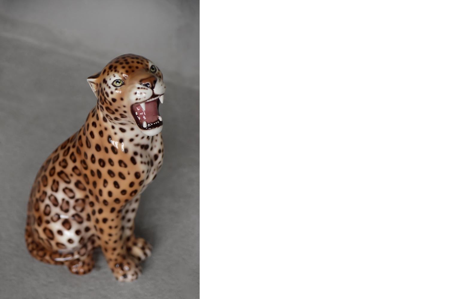 This large, ceramic leopard was made in Italy during the 1970s. Made of high-quality hand-painted ceramics. It looks very dignified and elegant. This decorative object has an imprinted stamp on the bottom with the words Made in Italy. This figure is