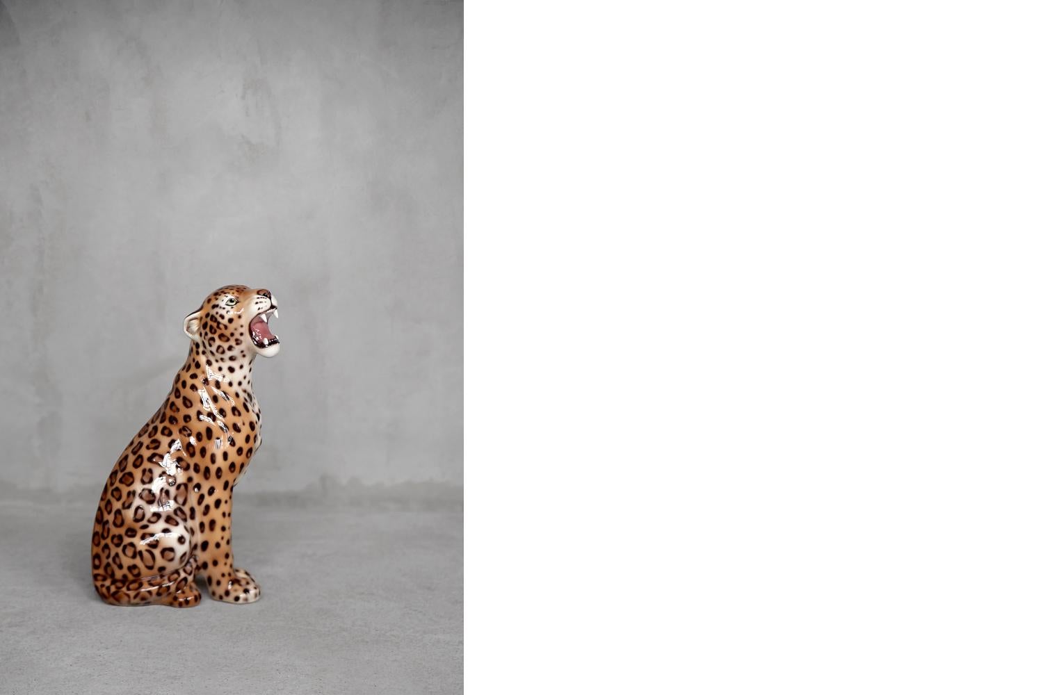 pink ceramic leopard statue