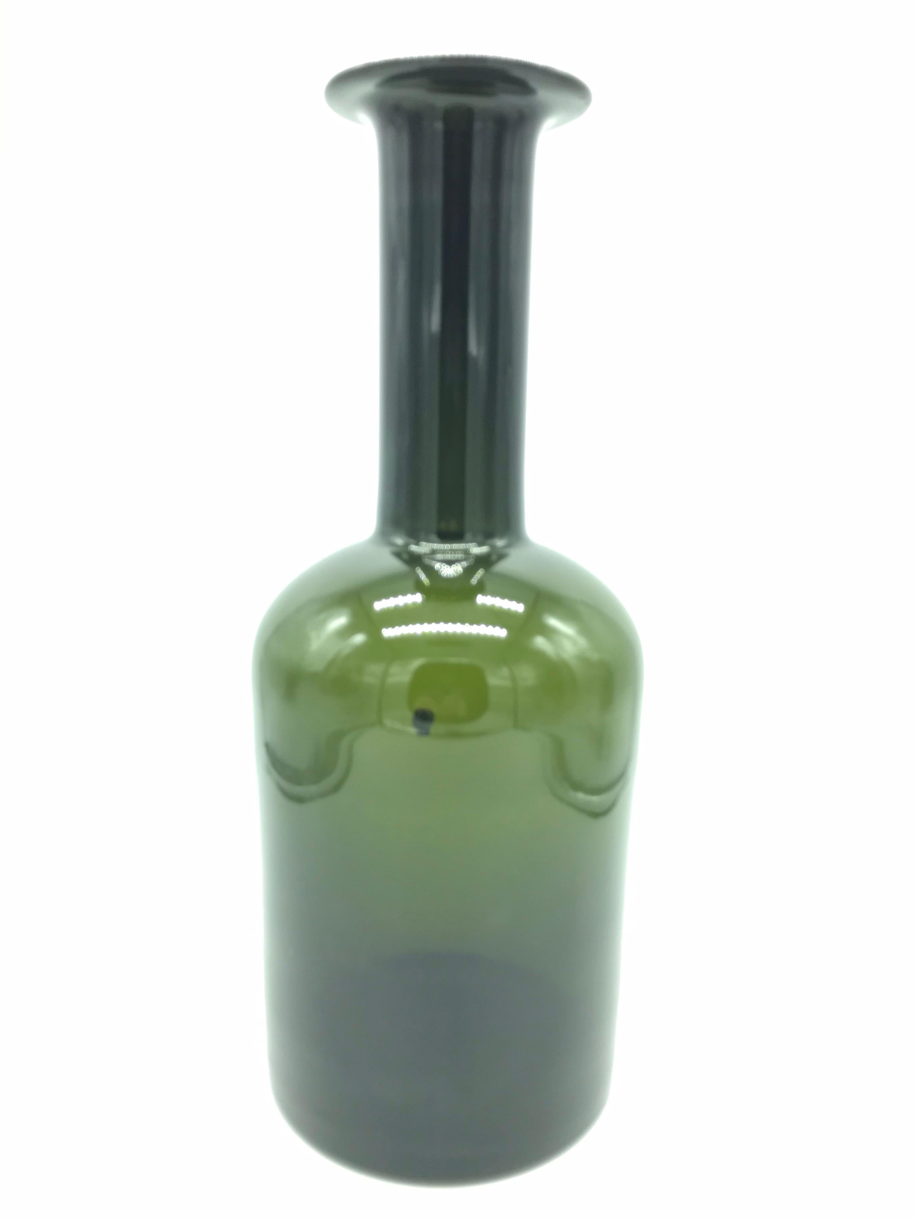 Very early original large Otto Brauer for Holmegaard floor table vase in green glass. 
Otto Brauer designed this iconic bottle shaped vase in 1959 and it was in production until 1980. 
The production was at Fyns Glassworks in Odense.
No chips or