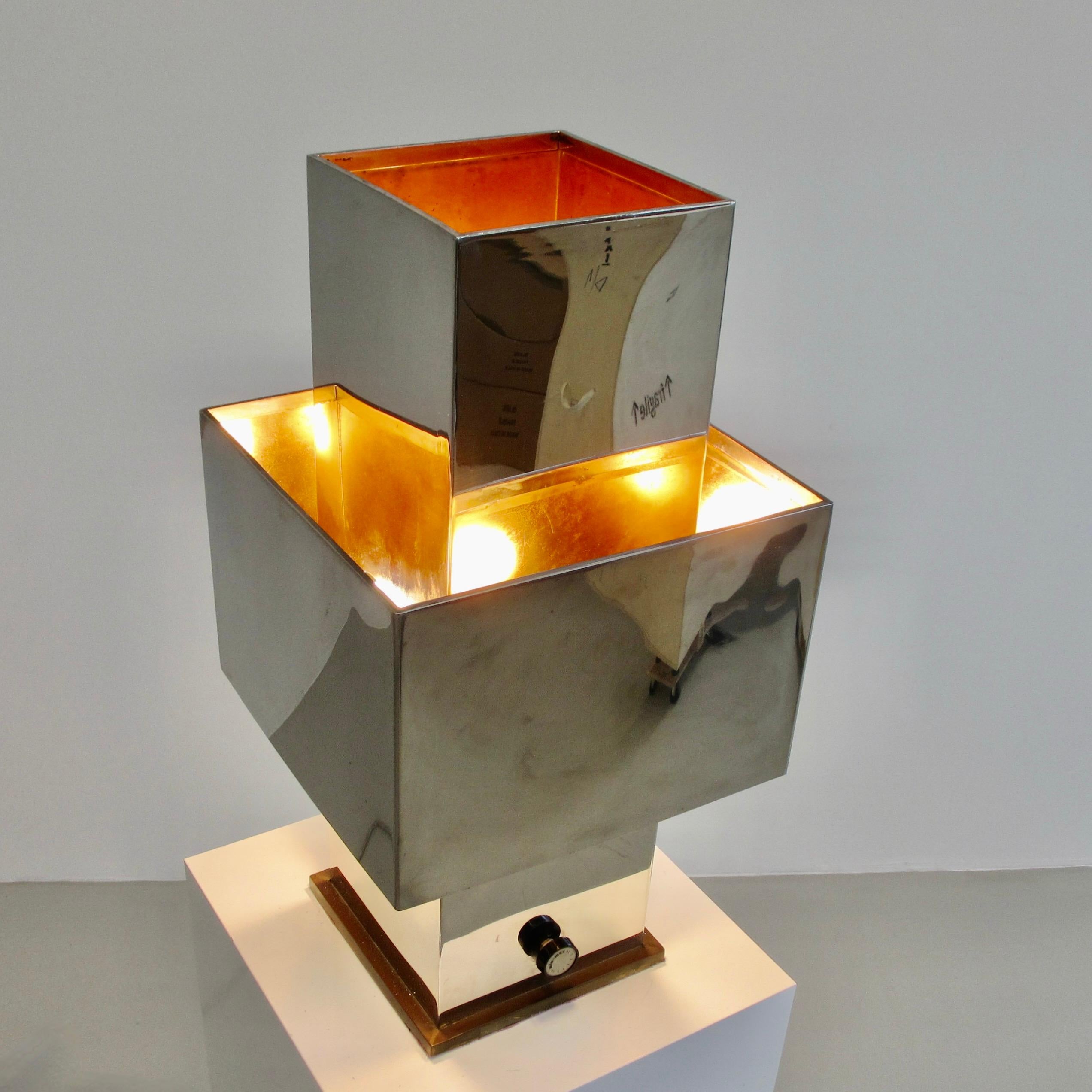 Original early table lamp by Willy Rizzo. Italy, 1970.

A large, square stainless steel lamp with copper lining, four-light sockets and original dimmer. The model LAMP-Q was designed in 1970. Rare early lamp by Willy Rizzo.

Literature: WILLY