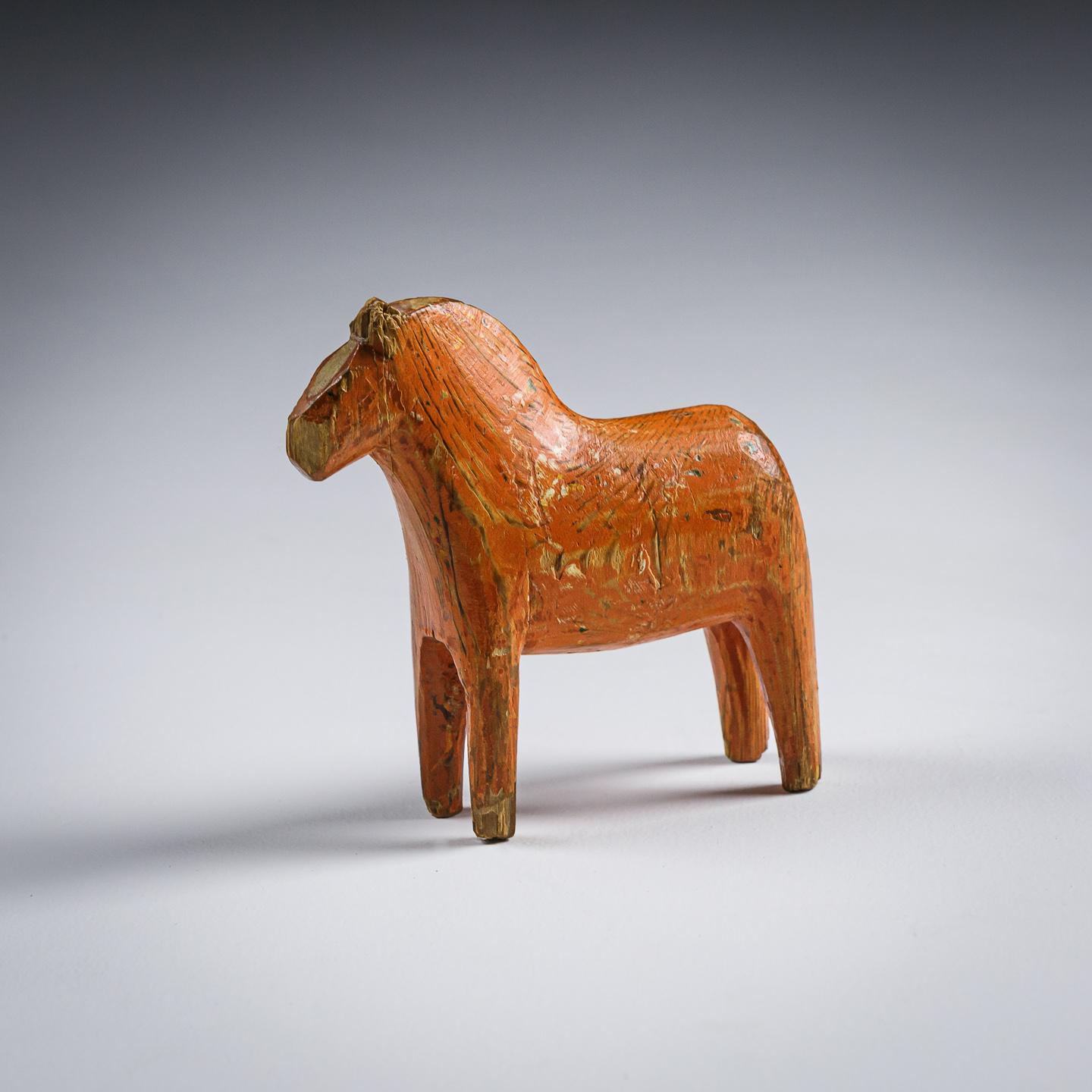 Primitive, bold carved pine Dala horse. Original worn painted finish.

The horses themselves, known as the North Swedish Horse were highly valued being symbols of both strength and courage, they have been present in Sweden for 4000 years. They